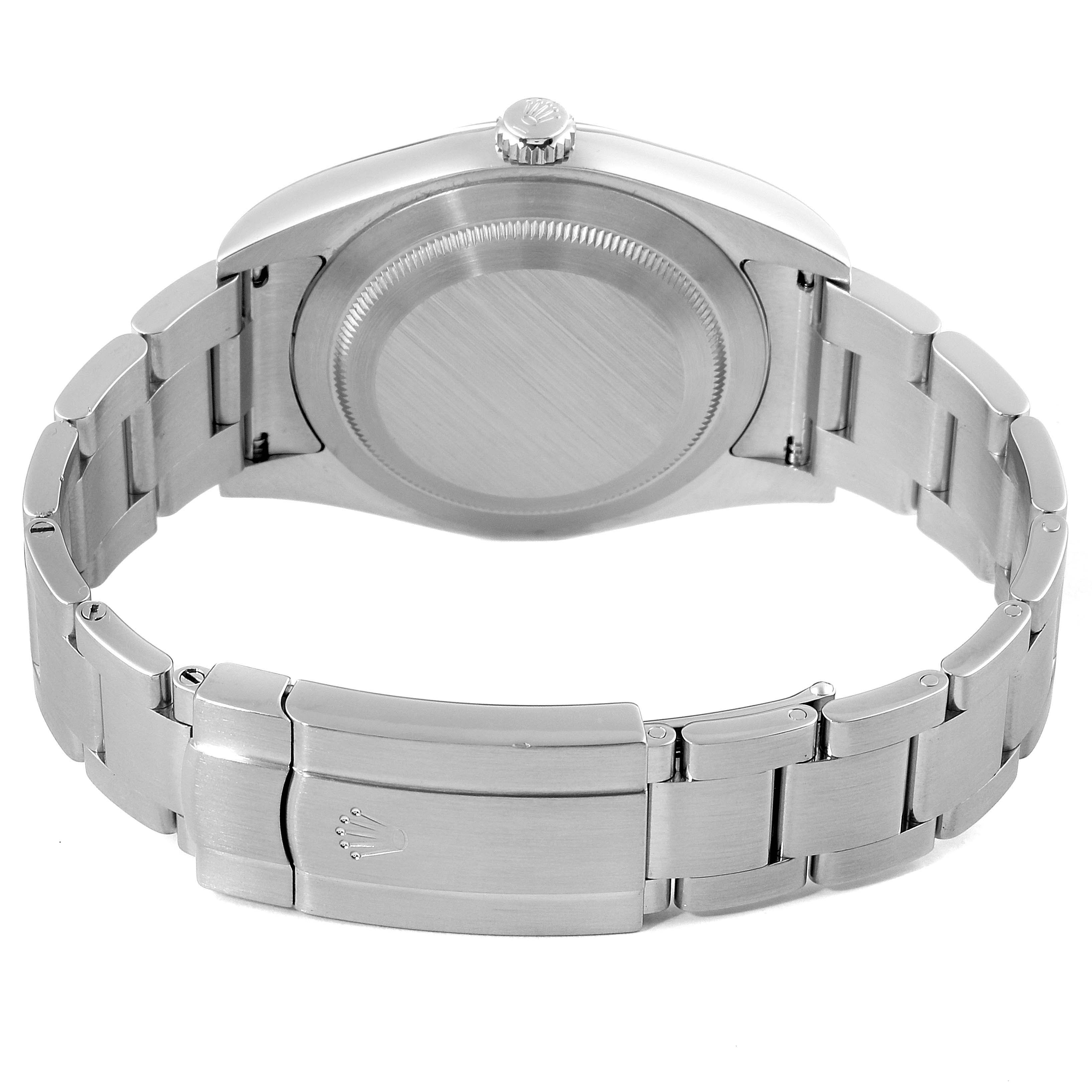 This is the back view of a Rolex Oyster Perpetual 114300 Men's Stainless Steel Blue Dial 114300 Men's Stainless Steel Blue Dial watch, showing the case back, crown, and bracelet clasp.