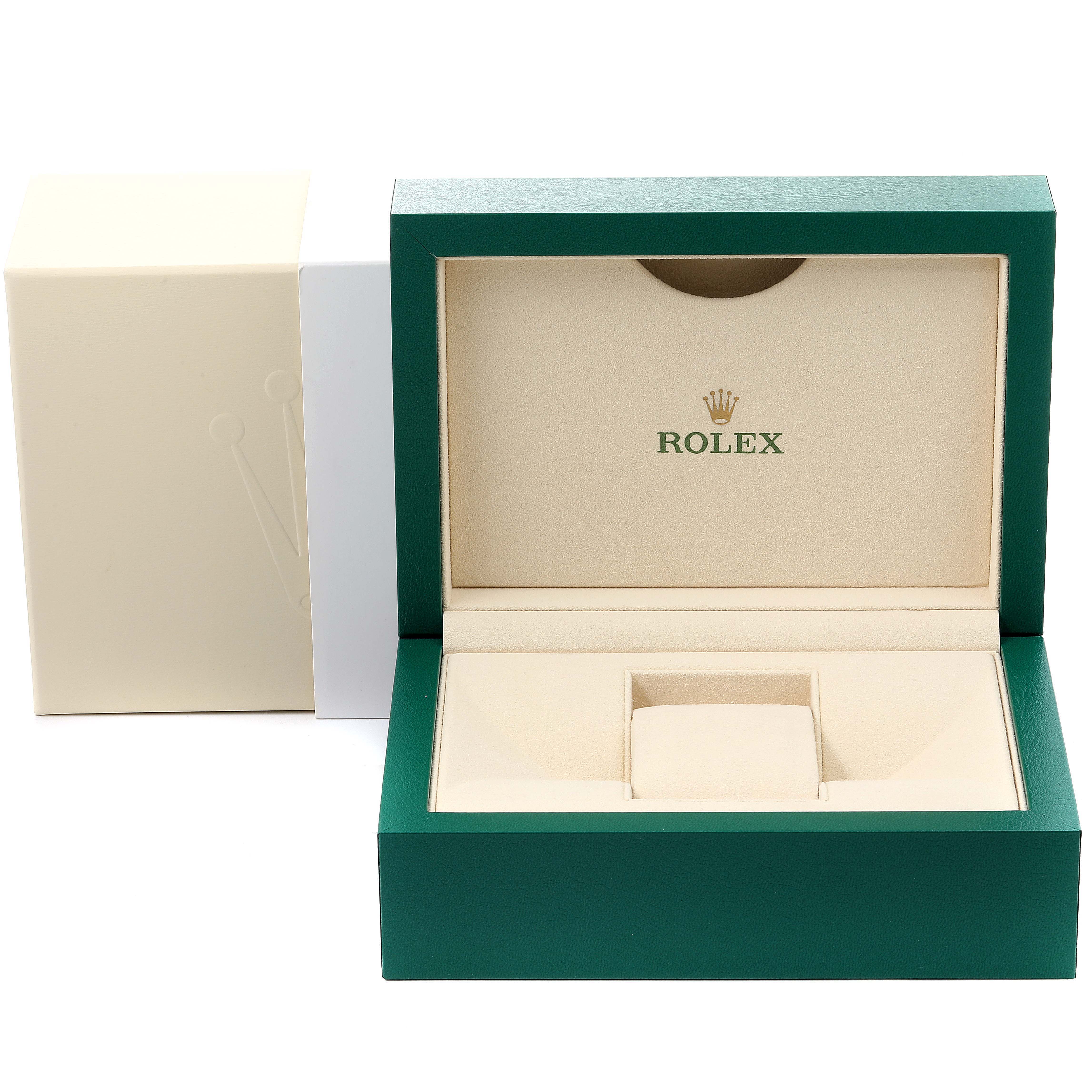 This image shows the open box and outer packaging for a Rolex Oyster Perpetual 114300 Men's Stainless Steel Blue Dial 114300 Men's Stainless Steel Blue Dial watch.