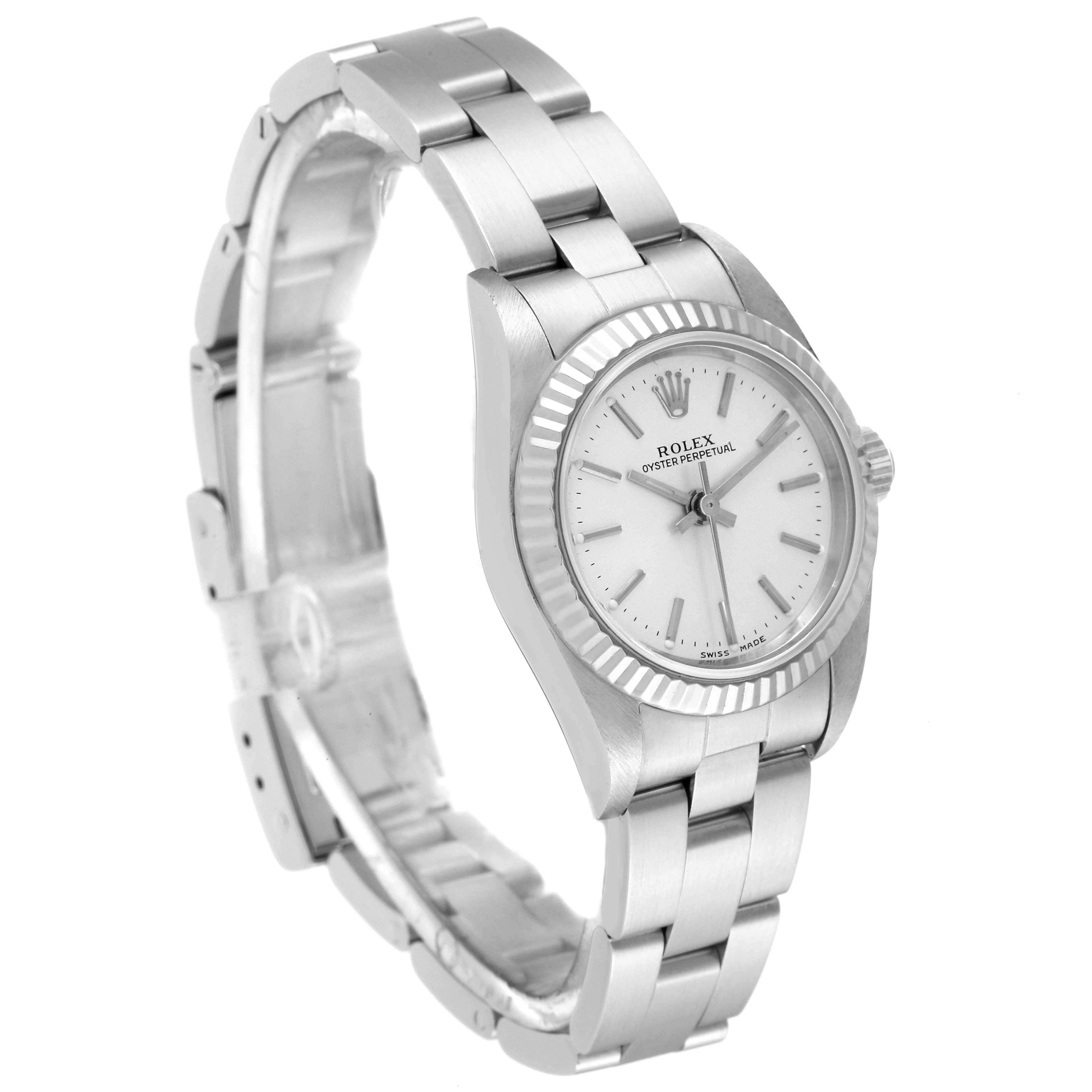 The image shows a side angle view of a Rolex Oyster Perpetual 76094 Women
s Stainless Steel Silver Dial 76094 Women
s Stainless Steel Silver Dial watch, featuring the dial, bezel, and bracelet.