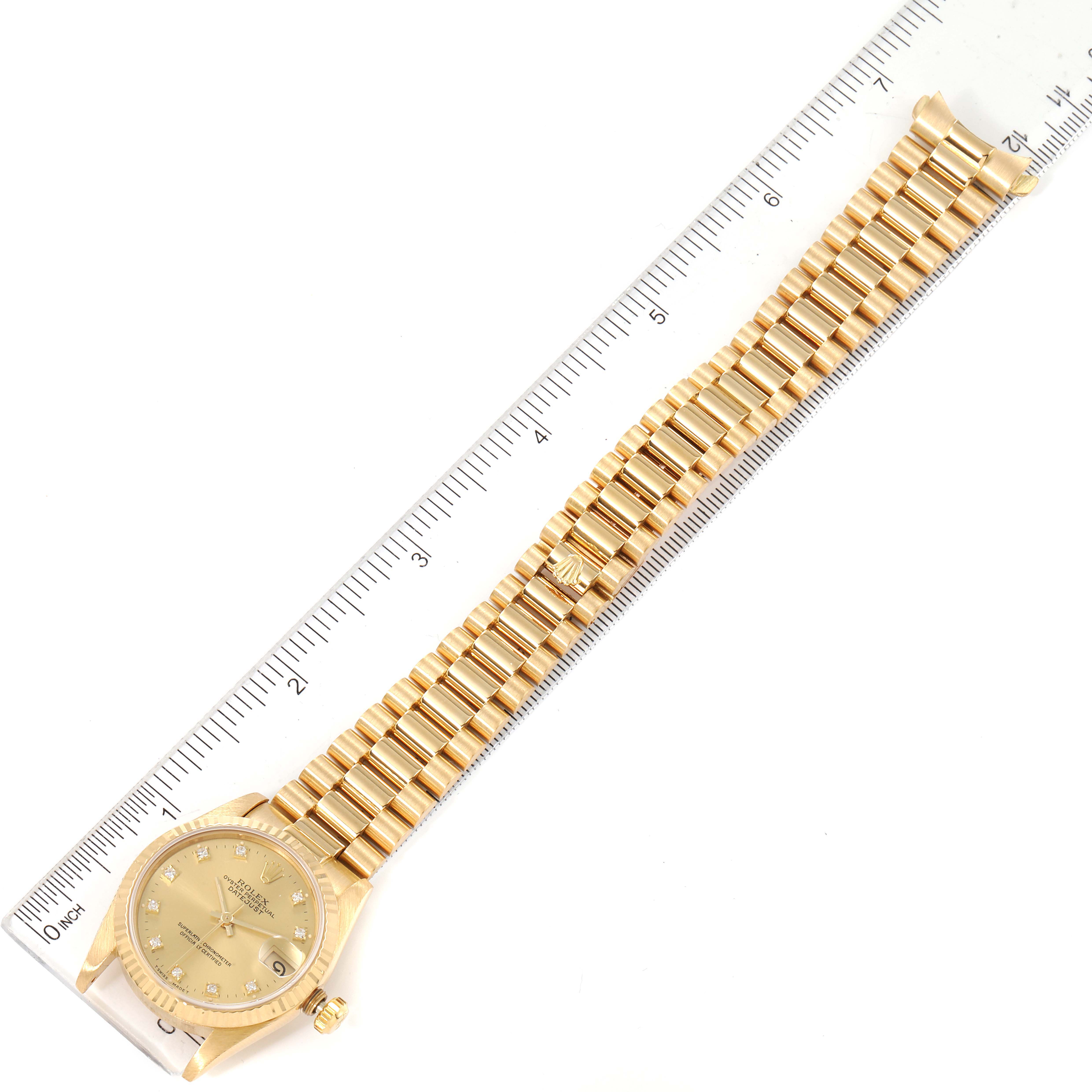 The image shows a top-down view of a Rolex President 68278 Women's Yellow Gold Champagne Dial 68278 Women's Yellow Gold Champagne Dial model watch, including its face, bezel, and the entirety of its bracelet.