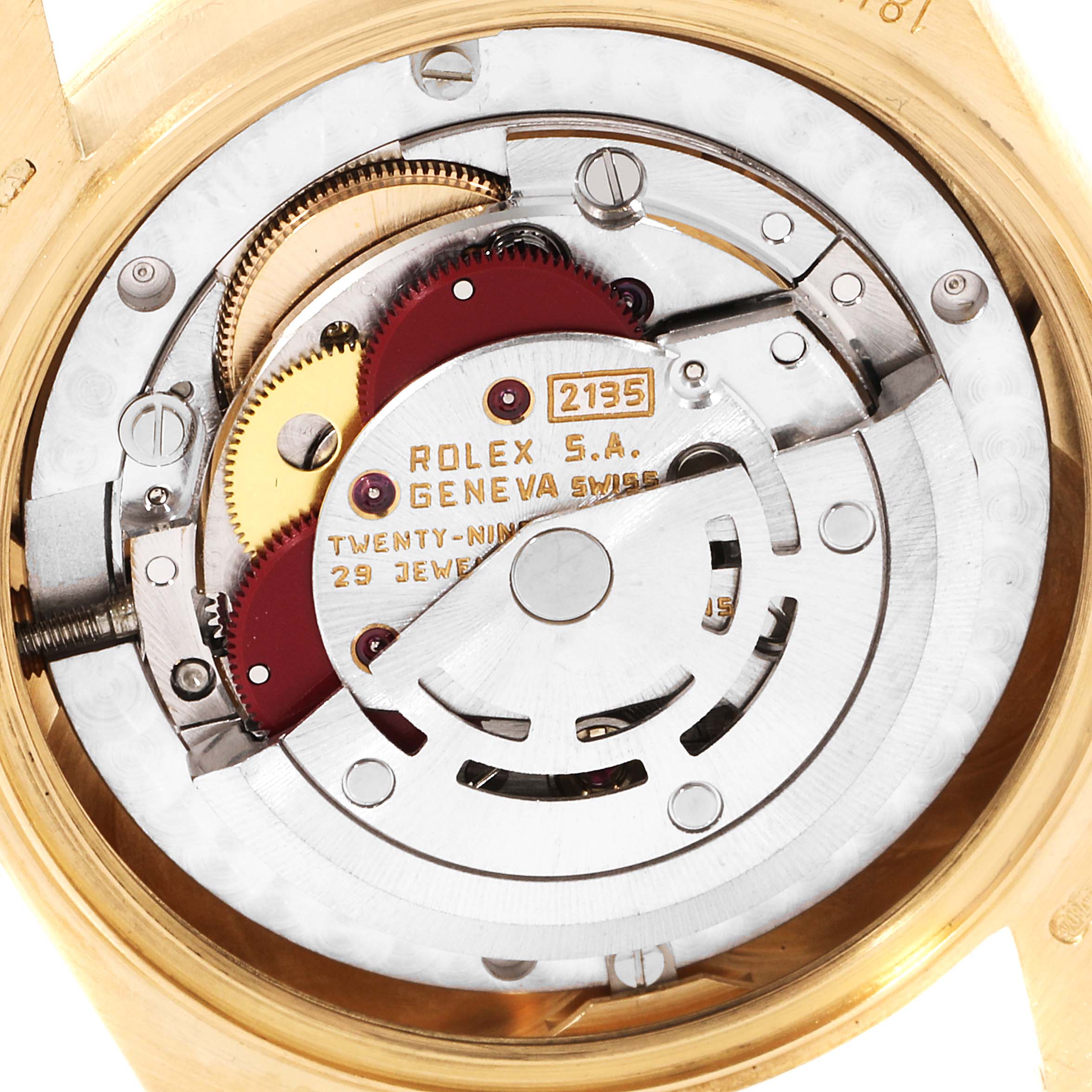 The image shows the internal movement mechanisms of a Rolex President 68278 Women's Yellow Gold Champagne Dial 68278 Women's Yellow Gold Champagne Dial model, focusing on the gears, rotor, and metal components.