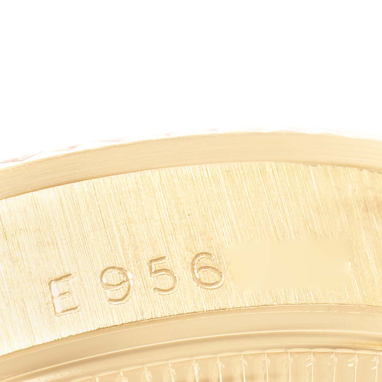 This image shows a close-up view of the serial number on the edge of a Rolex President 68278 Women's Yellow Gold Champagne Dial 68278 Women's Yellow Gold Champagne Dial model watch.