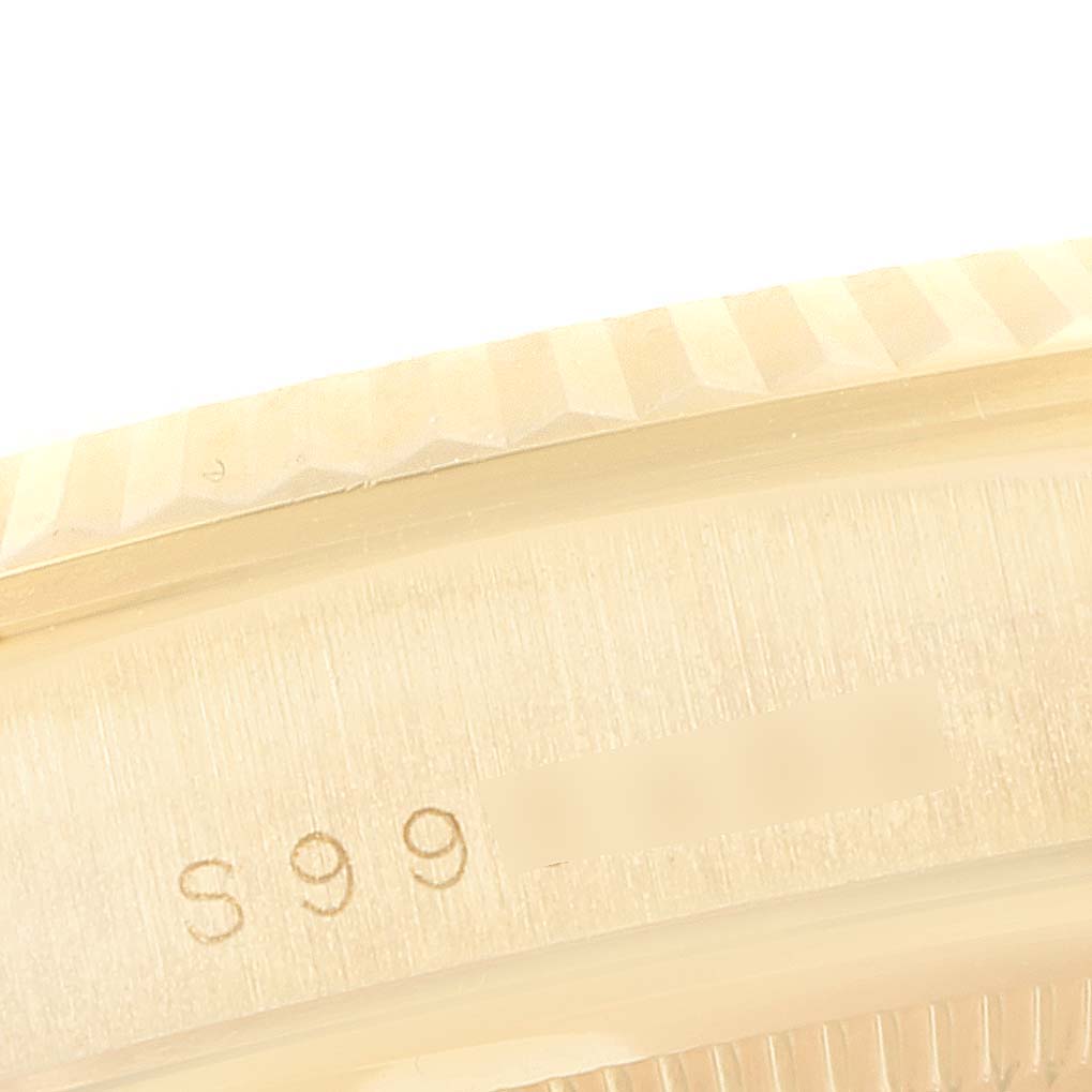 This close-up shows the case edge and part of the bezel of a Rolex President 18238 Men's Yellow Gold Champagne Dial 18238 Men's Yellow Gold Champagne Dial model watch.