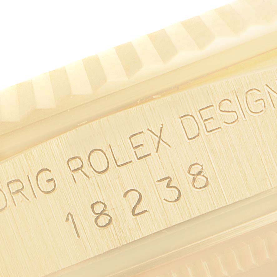 This image shows the side engraving of a Rolex President 18238 Men
s Yellow Gold Champagne Dial 18238 Men
s Yellow Gold Champagne Dial model watch, featuring the design number "18238."