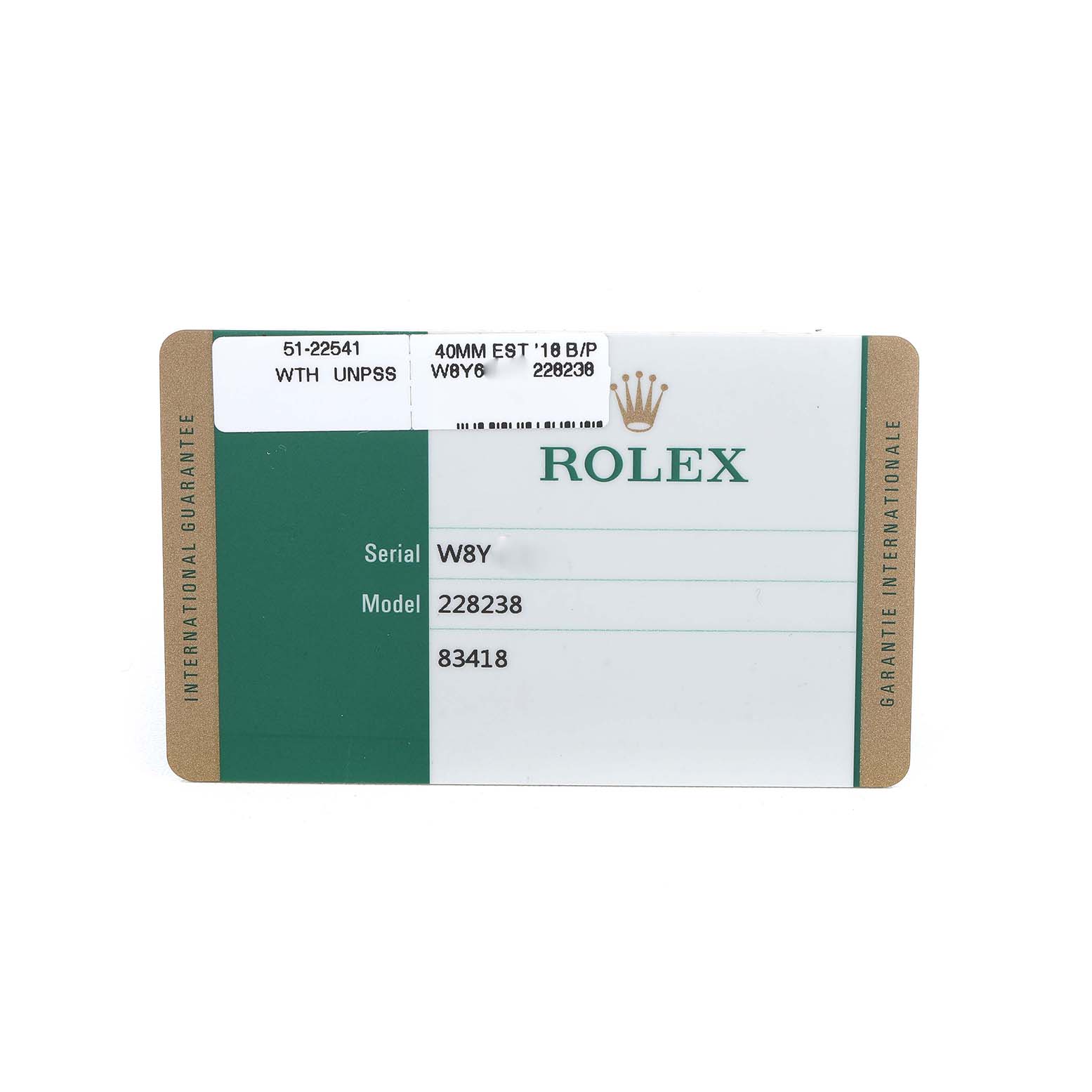 This image shows a warranty card for the Rolex President 228238 Men's Yellow Gold Champagne Dial model, displaying serial and model numbers.