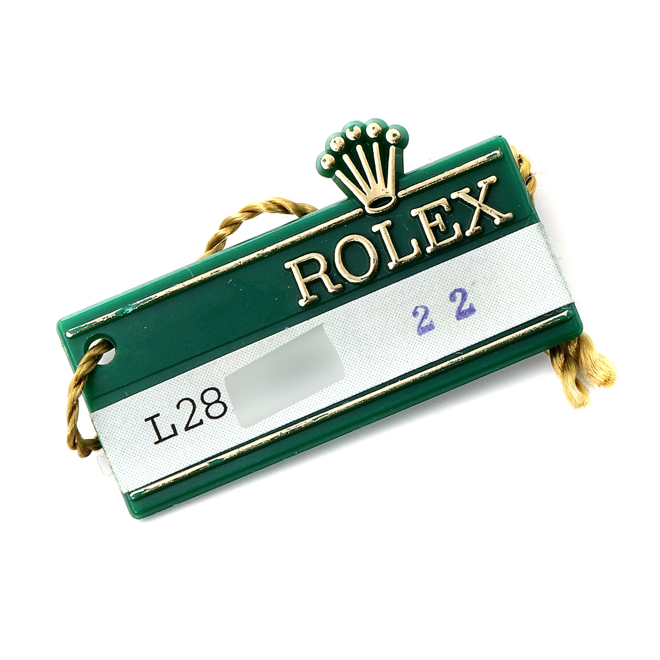 This image shows a Rolex President 18238 Men
s Yellow Gold Champagne Dial 18238 Men
s Yellow Gold Champagne Dial model
s green and gold tag with the Rolex logo and some text.