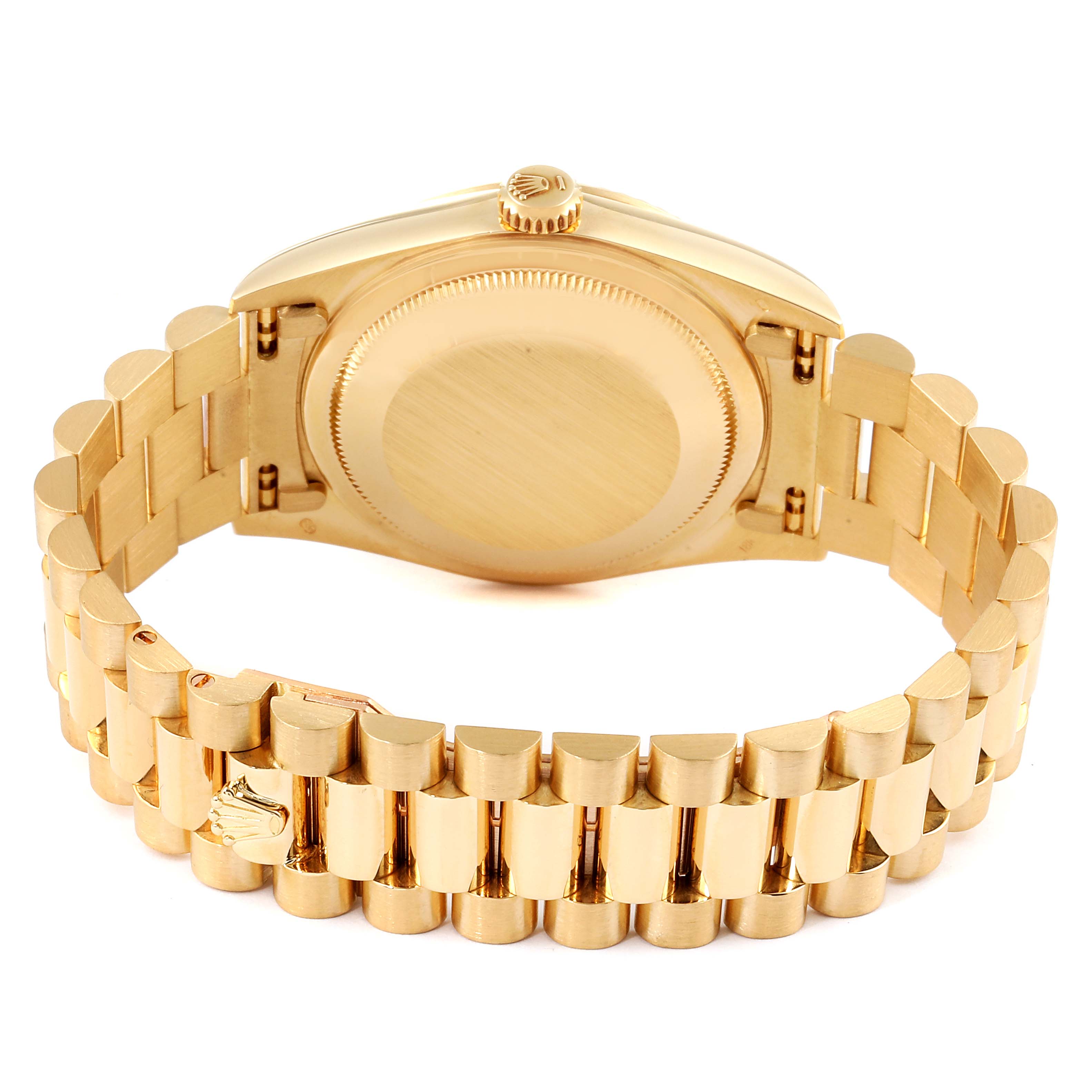 The Rolex President 18238 Men
s Yellow Gold Champagne Dial 18238 Men
s Yellow Gold Champagne Dial model watch is shown from the back, displaying the case back and the bracelet with the clasp open.