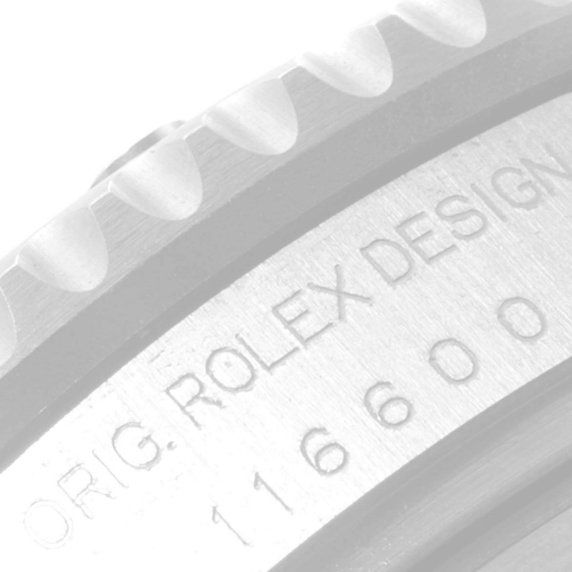 This image shows a close-up of the bezel and engraved case back of a Rolex Sea-Dweller 116600 Men's Stainless Steel Black Dial 116600 Men's Stainless Steel Black Dial model 116600.