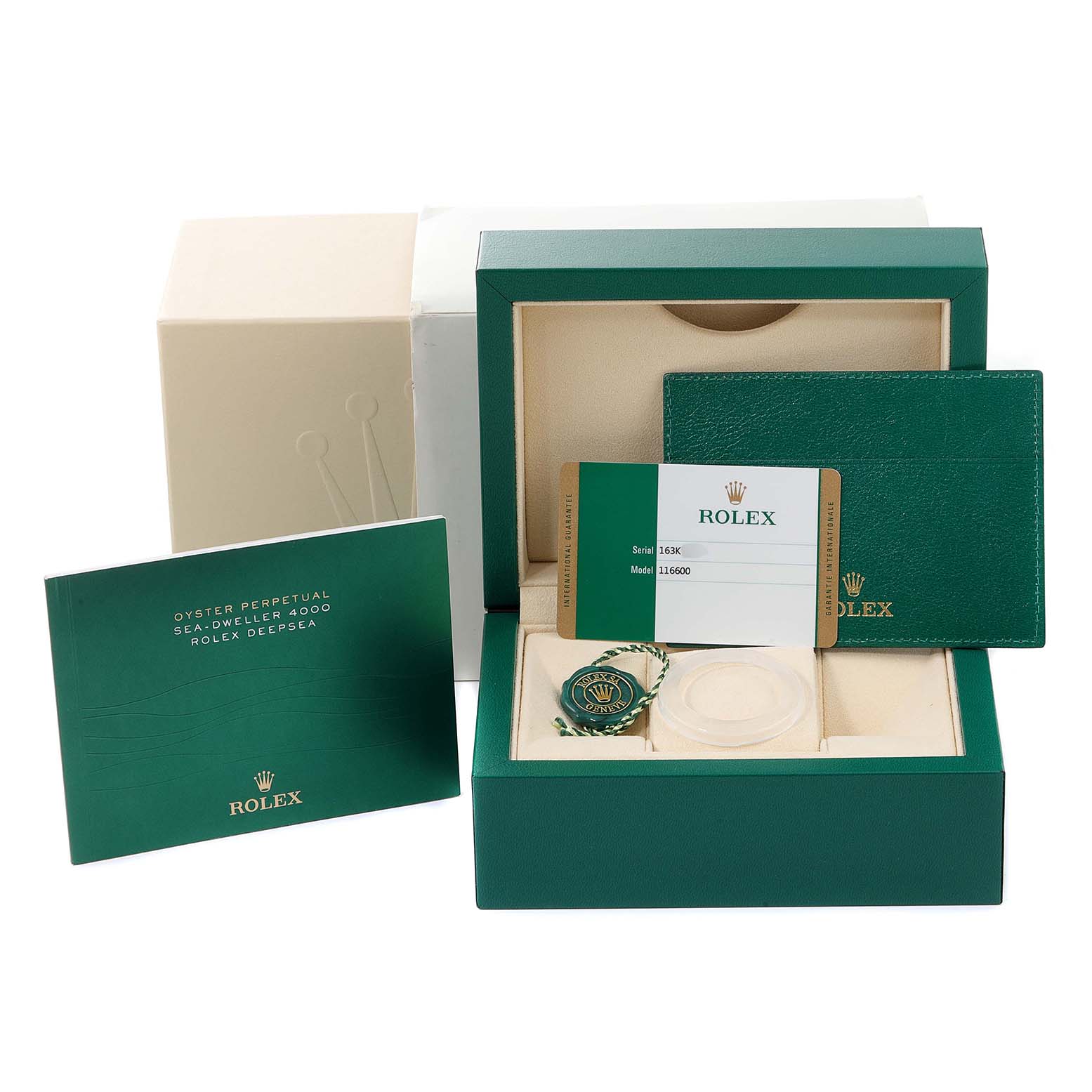 The image shows the packaging and accessories of a Rolex Sea-Dweller 116600 Men's Stainless Steel Black Dial 116600 Men's Stainless Steel Black Dial watch, including the box, booklet, card, and tags.