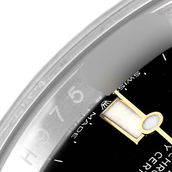 This close-up angle shows part of the dial and bezel of the Rolex Sea-Dweller 126603 Men's Steel and Gold (two tone) Black Dial 126603 Men's Steel and Gold (two tone) Black Dial watch.