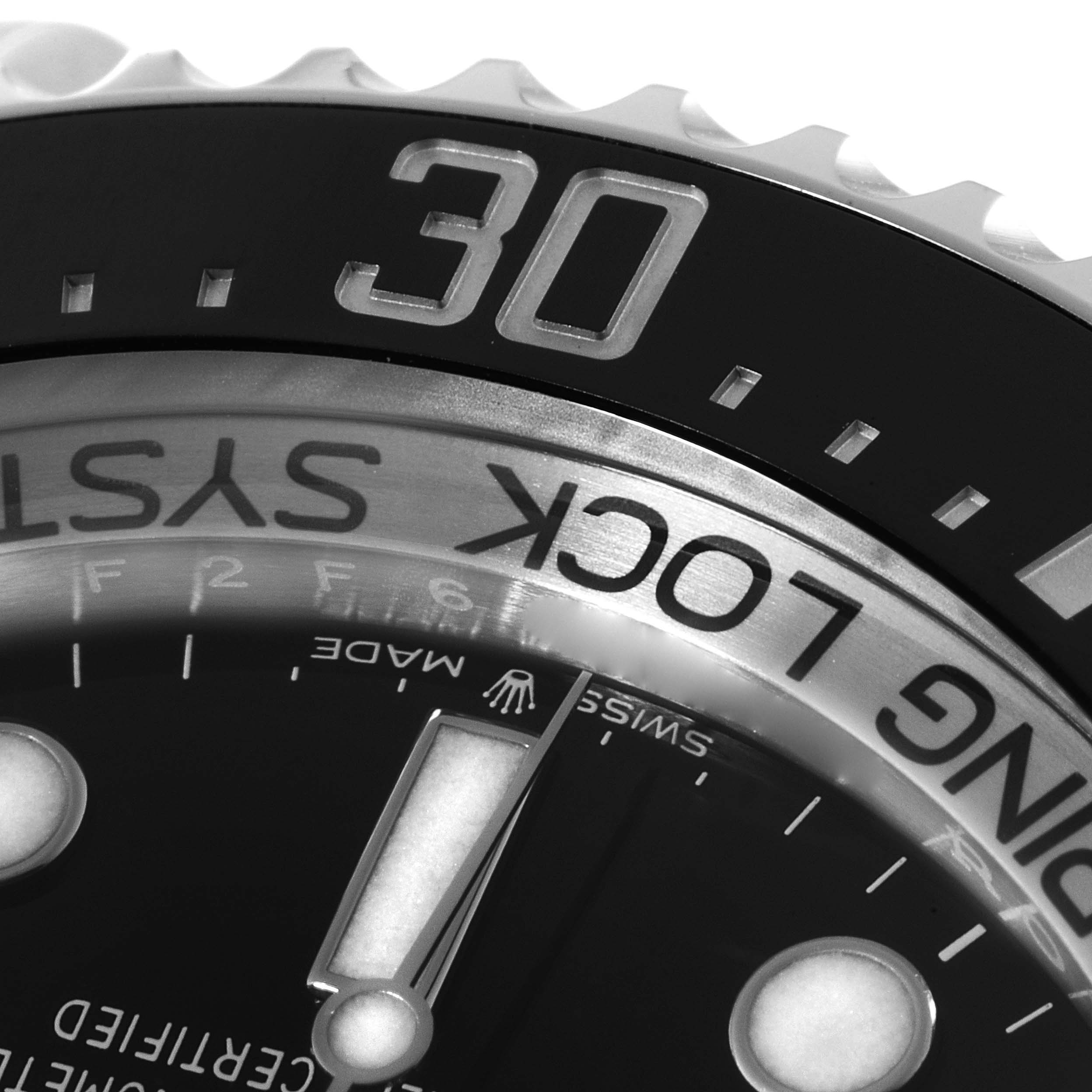 This close-up image of the Rolex Sea-Dweller 126660 Men
s Stainless Steel Blue Dial 126660 Men
s Stainless Steel Blue Dial shows the watch bezel and part of the dial with the minute markers and "ROLEX" text.