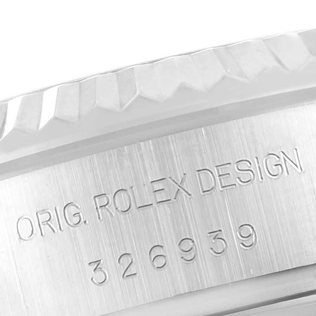 This image shows a close-up of the serial number and engraved text on the side of the Rolex Sky-Dweller 326939 Men's White Gold White Dial 326939 Men's White Gold White Dial watch case.
