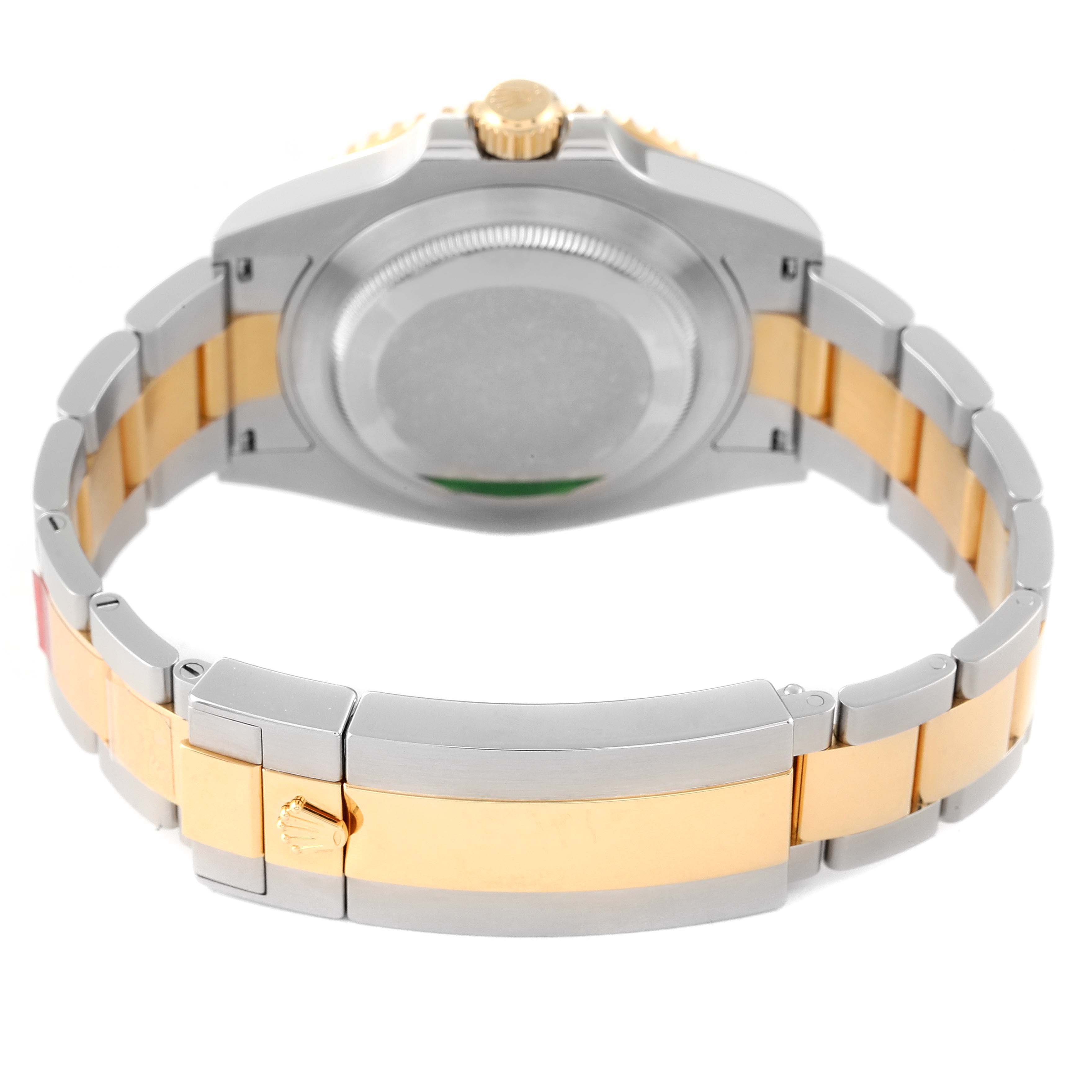 This image shows the back side of a Rolex Submariner 126613 Men's Steel and Gold (two tone) Blue Dial 126613 Men's Steel and Gold (two tone) Blue Dial watch, including the clasp and bracelet.