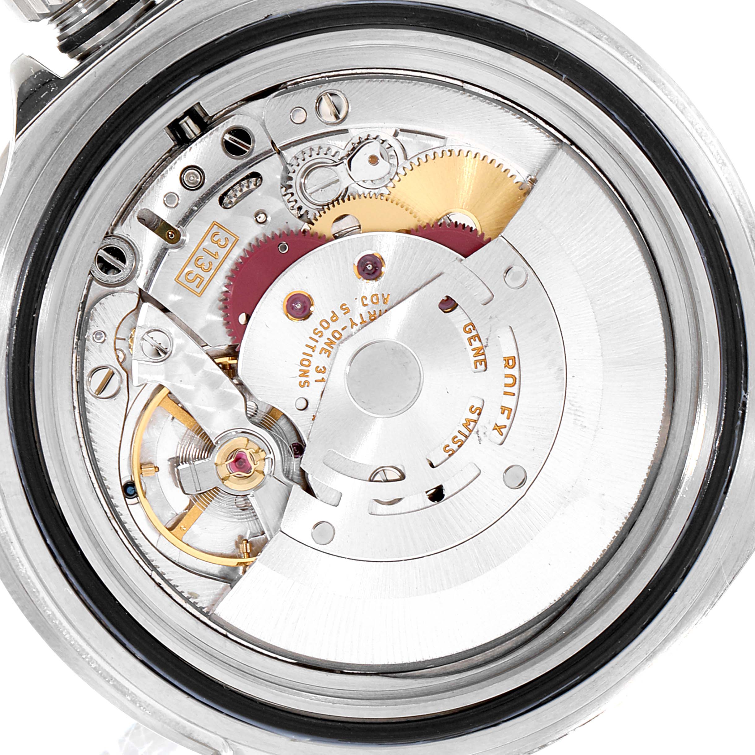 The image shows the intricate internal mechanism of a Rolex Submariner 16610 Men
s Stainless Steel Black Dial 16610 Men
s Stainless Steel Black Dial watch, highlighting gears and other watch parts.