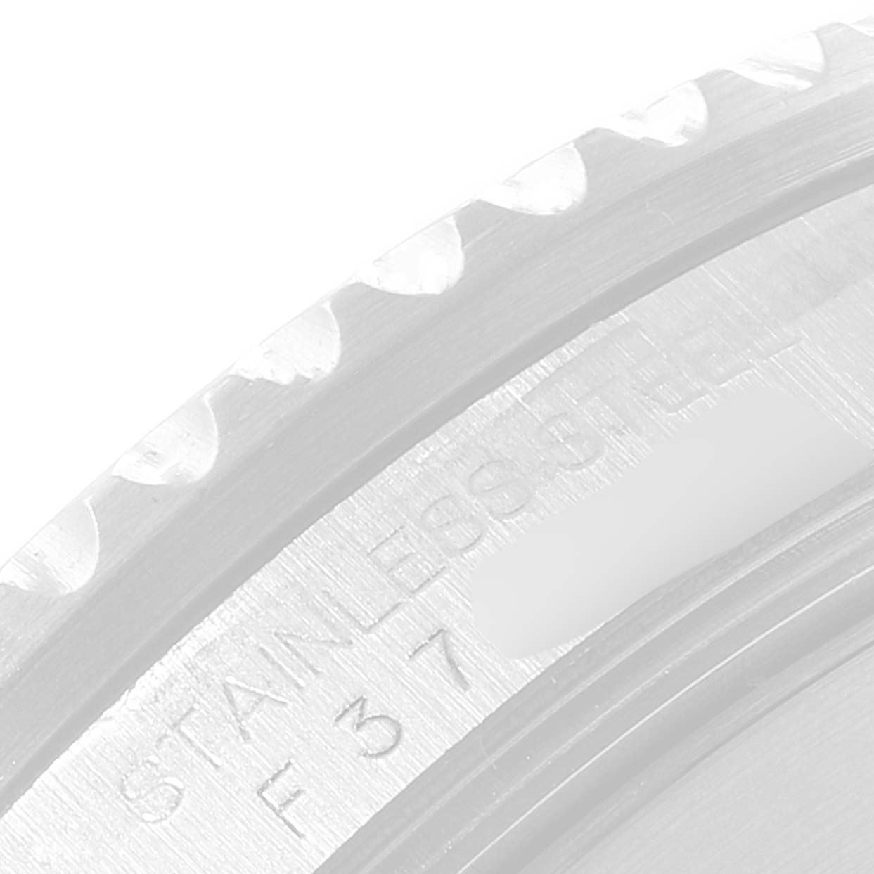 The image shows a close-up of the bezel and engraved wording on the side of a Rolex Submariner 16610 Men
s Stainless Steel Black Dial 16610 Men
s Stainless Steel Black Dial watch case.