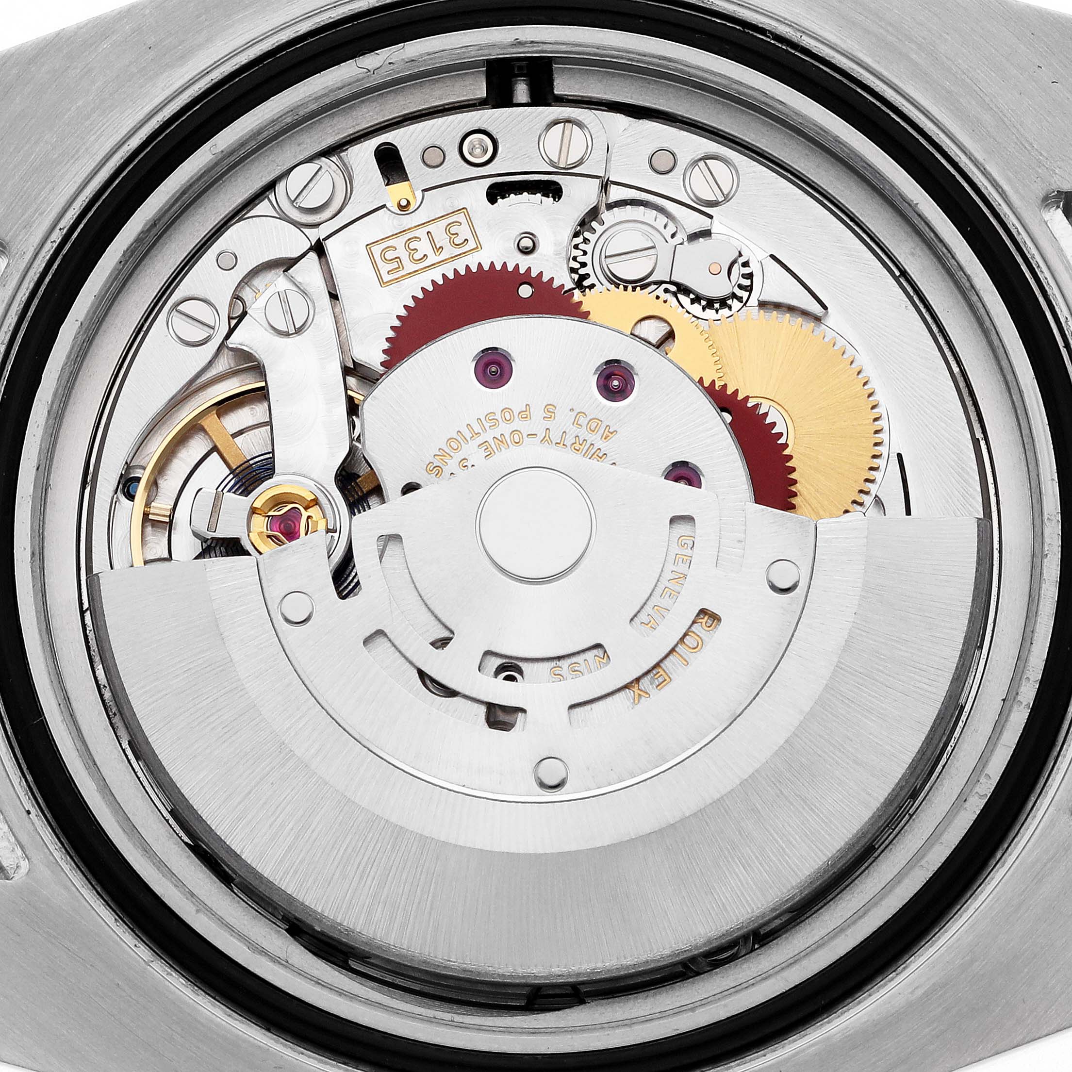 The image shows the movement of a Rolex Submariner 116610LN Men's Stainless Steel Black Dial 116610LN Men's Stainless Steel Black Dial watch from a close-up, top-down angle, revealing gears and internal components.