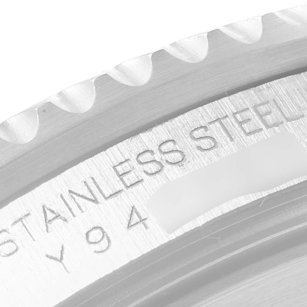 This image shows a close-up of the bezel and case back of a Rolex Submariner 16610LV Men's Stainless Steel Black Dial 16610LV Men's Stainless Steel Black Dial, highlighting the "Stainless Steel" engraving.