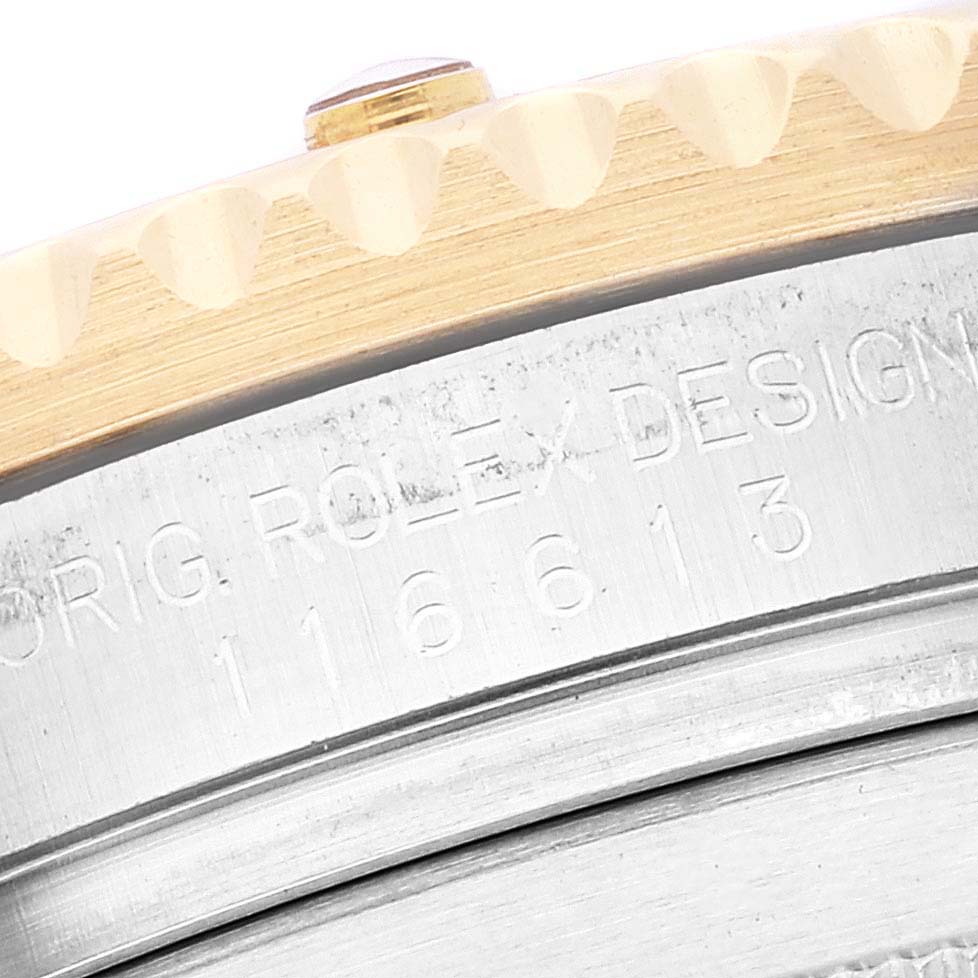 This image shows a close-up of the case side, bezel, and model number engraving on a Rolex Submariner 116613 Men's Steel and Gold (two tone) Blue Dial 116613 Men's Steel and Gold (two tone) Blue Dial.