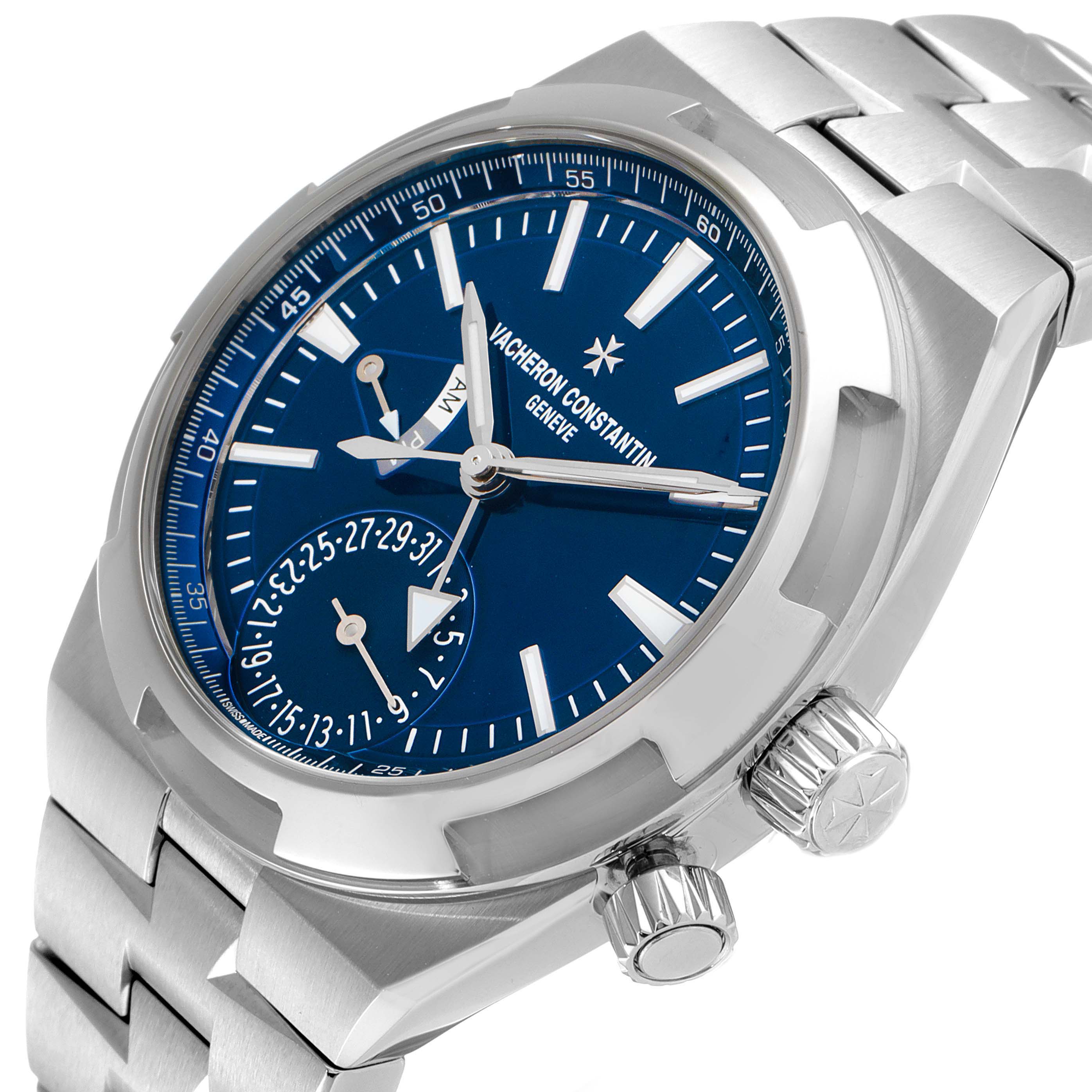The image shows a Vacheron Constantin Overseas 7900V/110A-B334 Men's Stainless Steel Blue Dial 7900V/110A-B334 Men's Stainless Steel Blue Dial watch at a slight angle, highlighting the blue dial, hour markers, crown, and part of the bracelet.