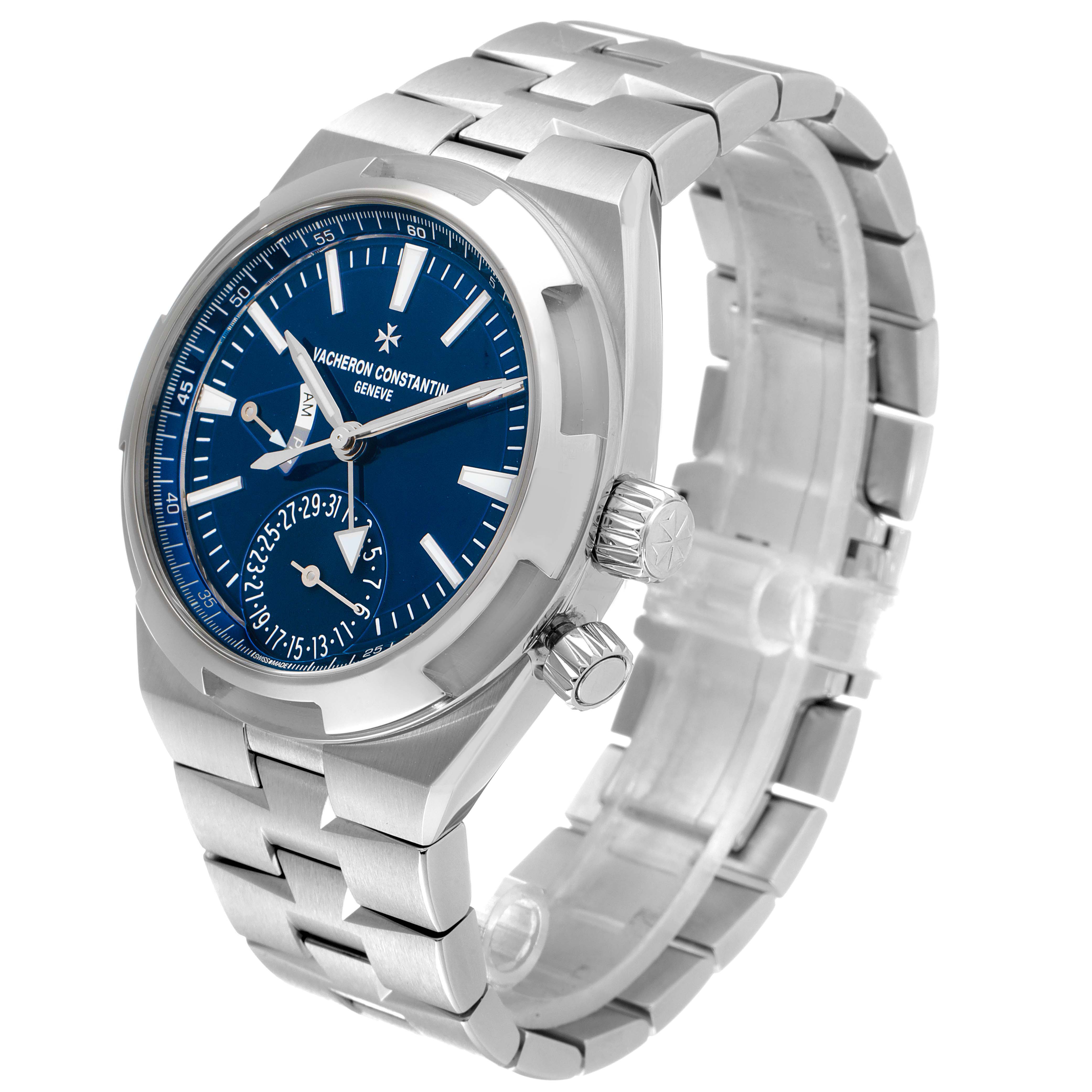 The image shows a Vacheron Constantin Overseas 7900V/110A-B334 Men's Stainless Steel Blue Dial 7900V/110A-B334 Men's Stainless Steel Blue Dial model watch at a three-quarter angle, highlighting its blue dial, crown, and stainless steel bracelet.