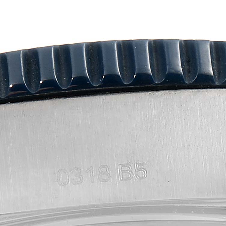 This close-up image shows the bezel and engraved serial number on the caseback of a Breitling Superocean Y1739310 Men's Stainless Steel Blue Dial Y1739310 Men's Stainless Steel Blue Dial watch.