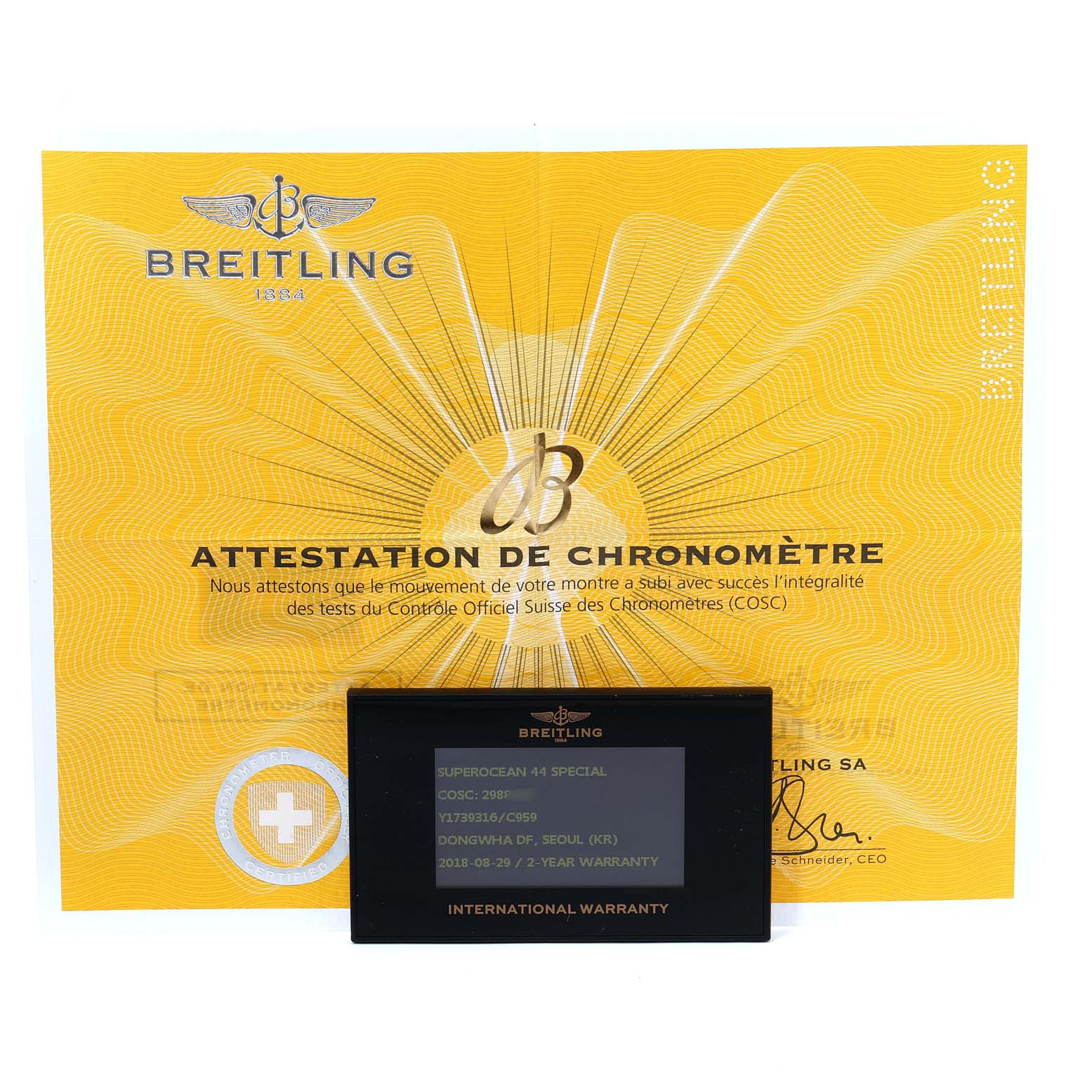 The image shows the certification and warranty card for the Breitling Superocean Y1739310 Men's Stainless Steel Blue Dial Y1739310 Men's Stainless Steel Blue Dial model, presented from a front angle.