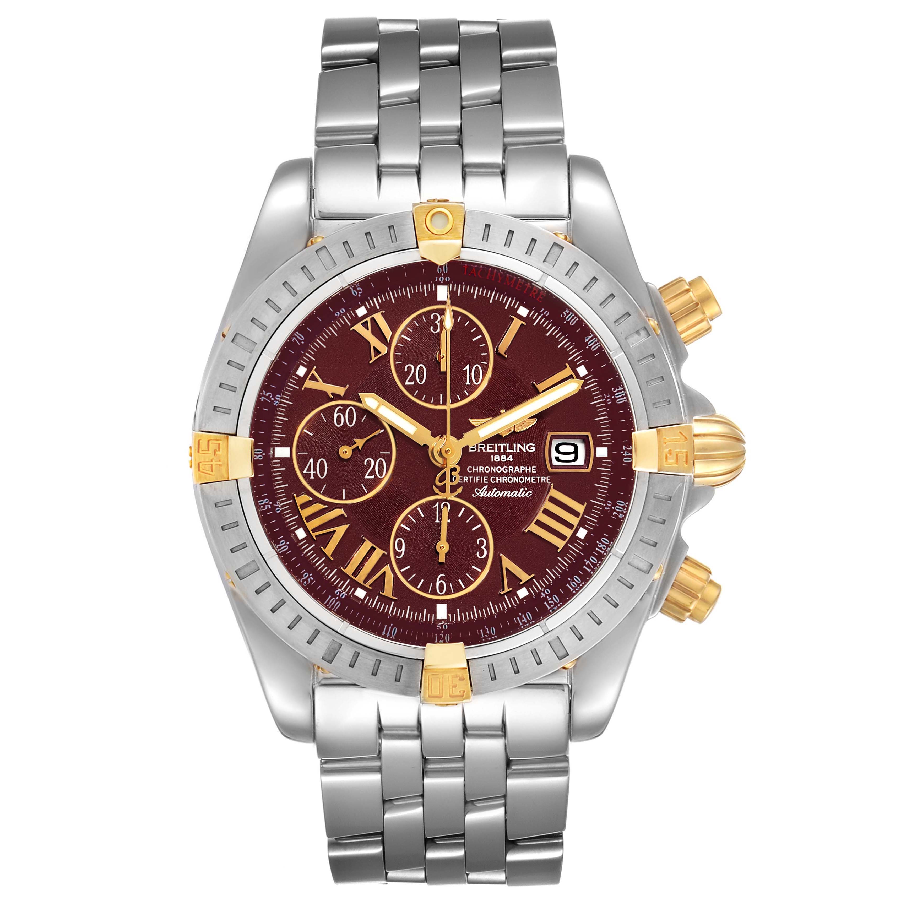 The Breitling Chronomat B13356 Men's Steel and Gold (two tone) Burgundy Dial B13356 Men's Steel and Gold (two tone) Burgundy Dial watch is shown from a top-down angle, highlighting the dial, bezel, and bracelet.