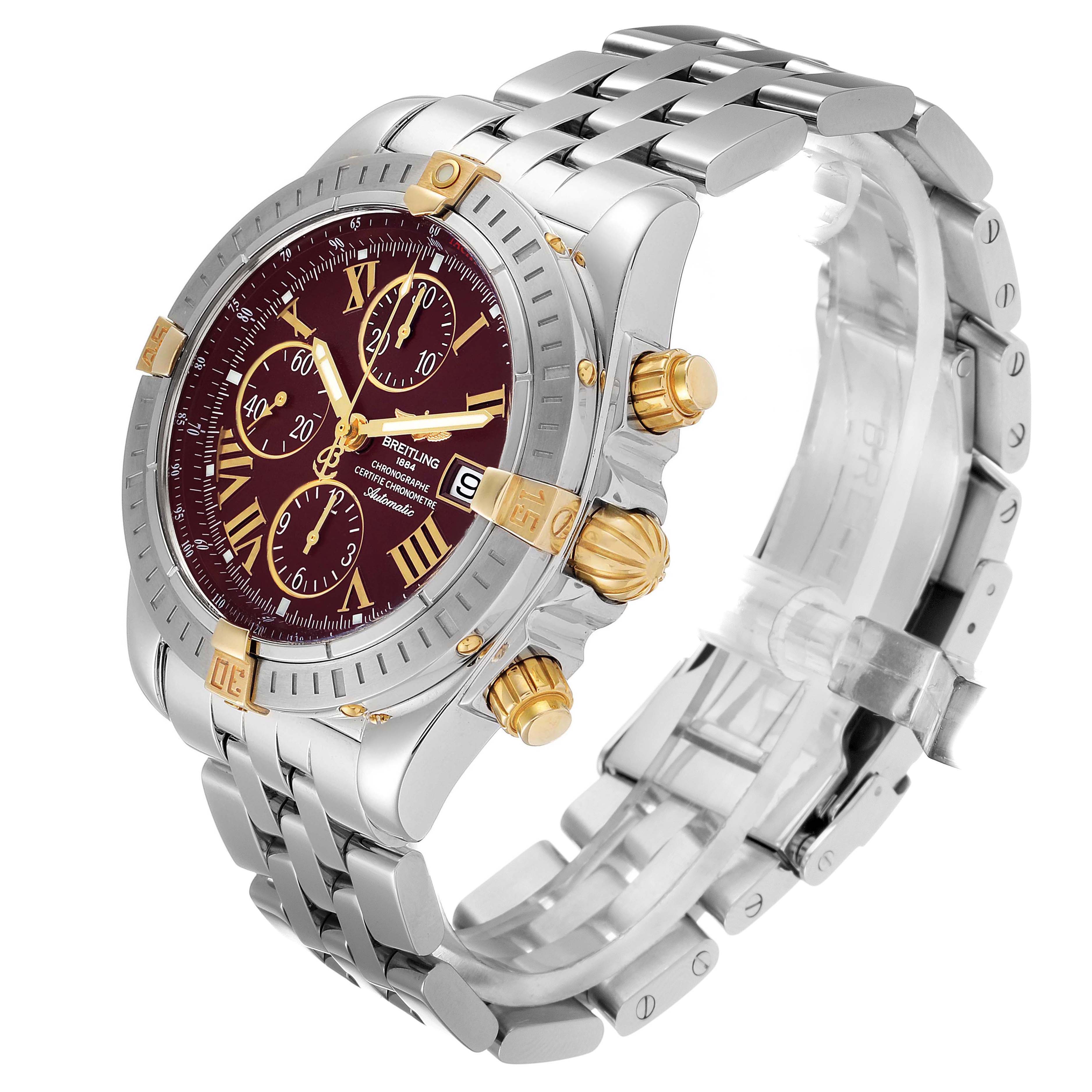 This image shows a Breitling Chronomat B13356 Men's Steel and Gold (two tone) Burgundy Dial B13356 Men's Steel and Gold (two tone) Burgundy Dial watch at a three-quarter angle, highlighting the case, dial, pushers, crown, and bracelet.