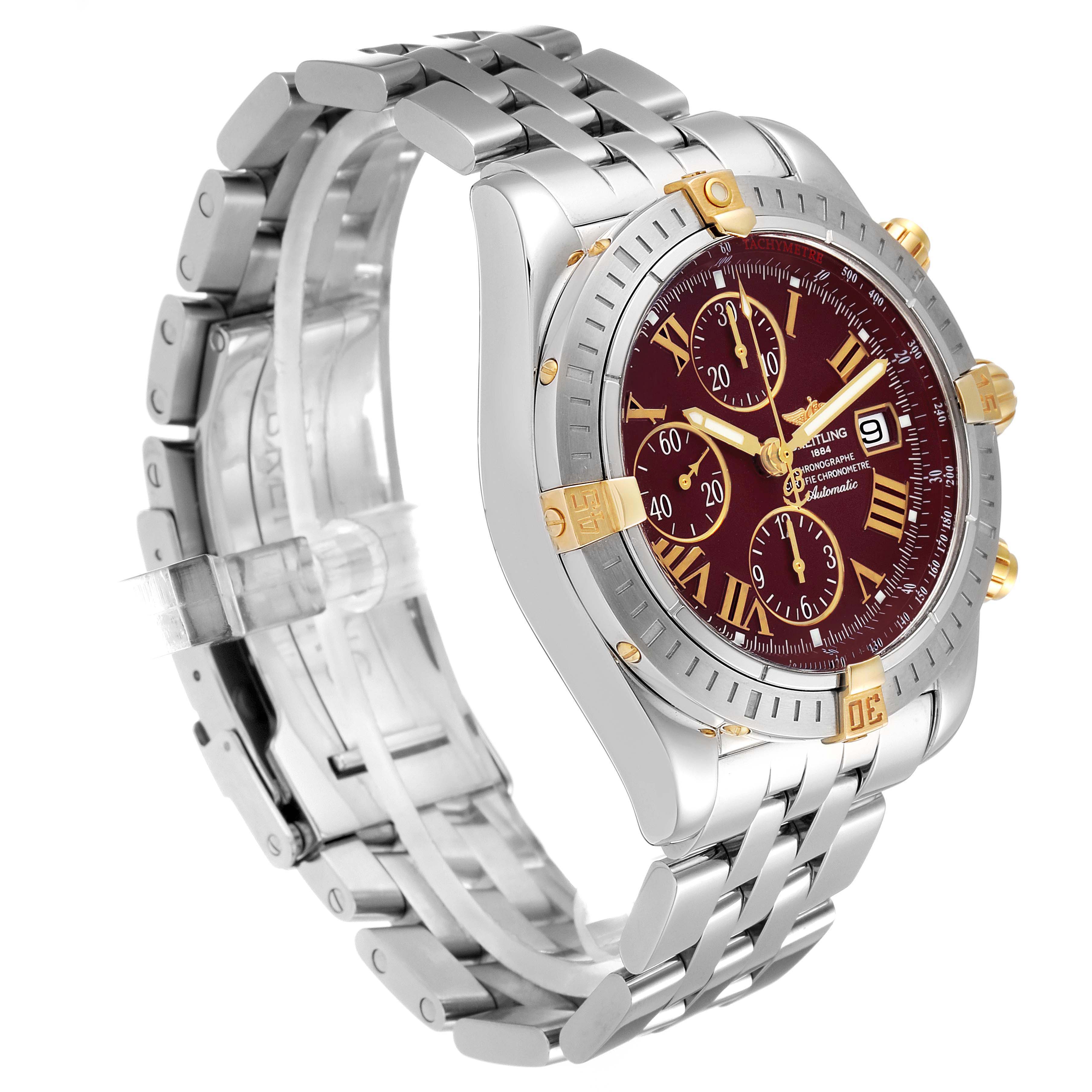 The image shows a Breitling Chronomat B13356 Men's Steel and Gold (two tone) Burgundy Dial B13356 Men's Steel and Gold (two tone) Burgundy Dial watch at a three-quarter angle, highlighting the dial, bezel, and metal bracelet.