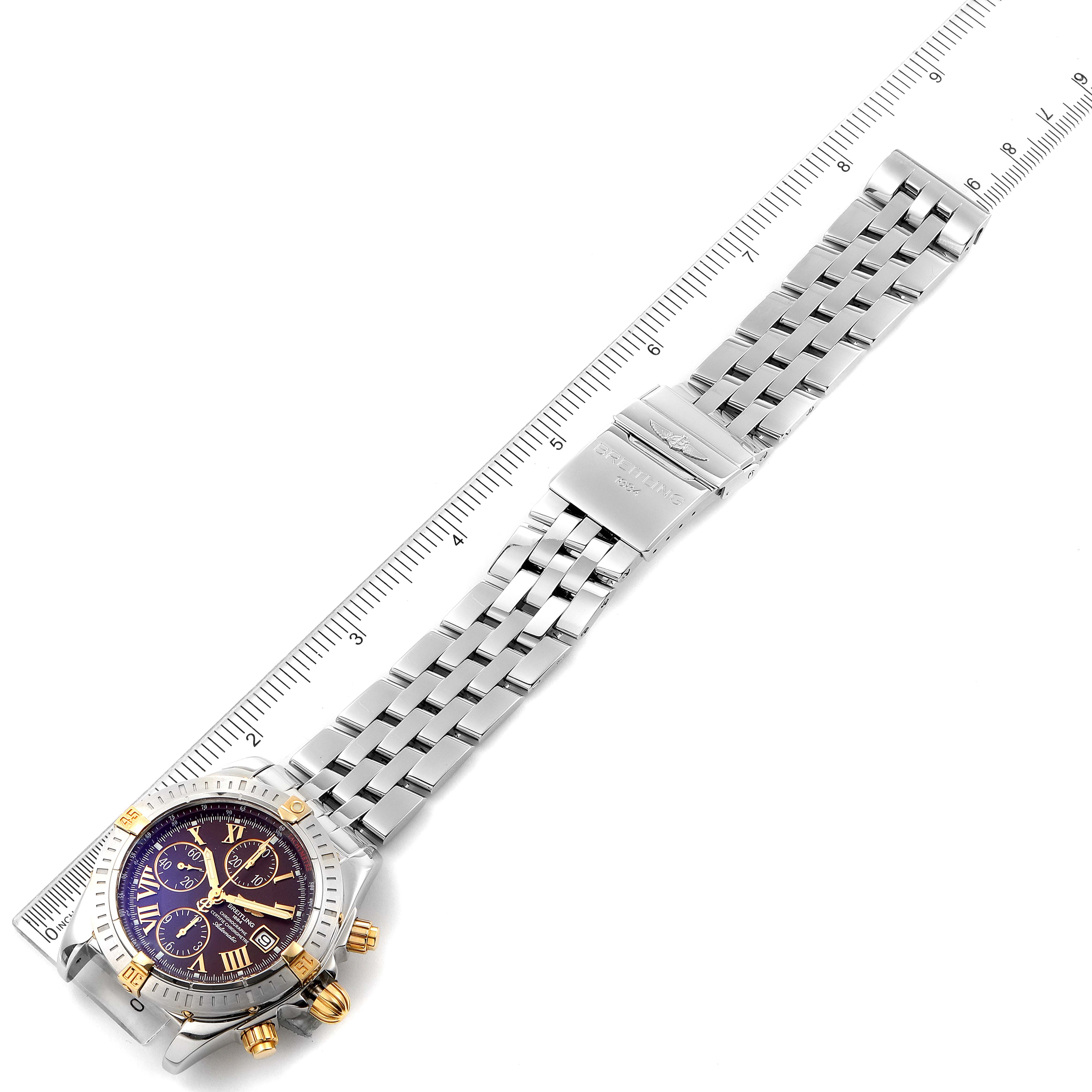 The Breitling Chronomat B13356 Men's Steel and Gold (two tone) Burgundy Dial B13356 Men's Steel and Gold (two tone) Burgundy Dial watch is shown from a top-down angle, displaying the face, bezel, and entire bracelet.