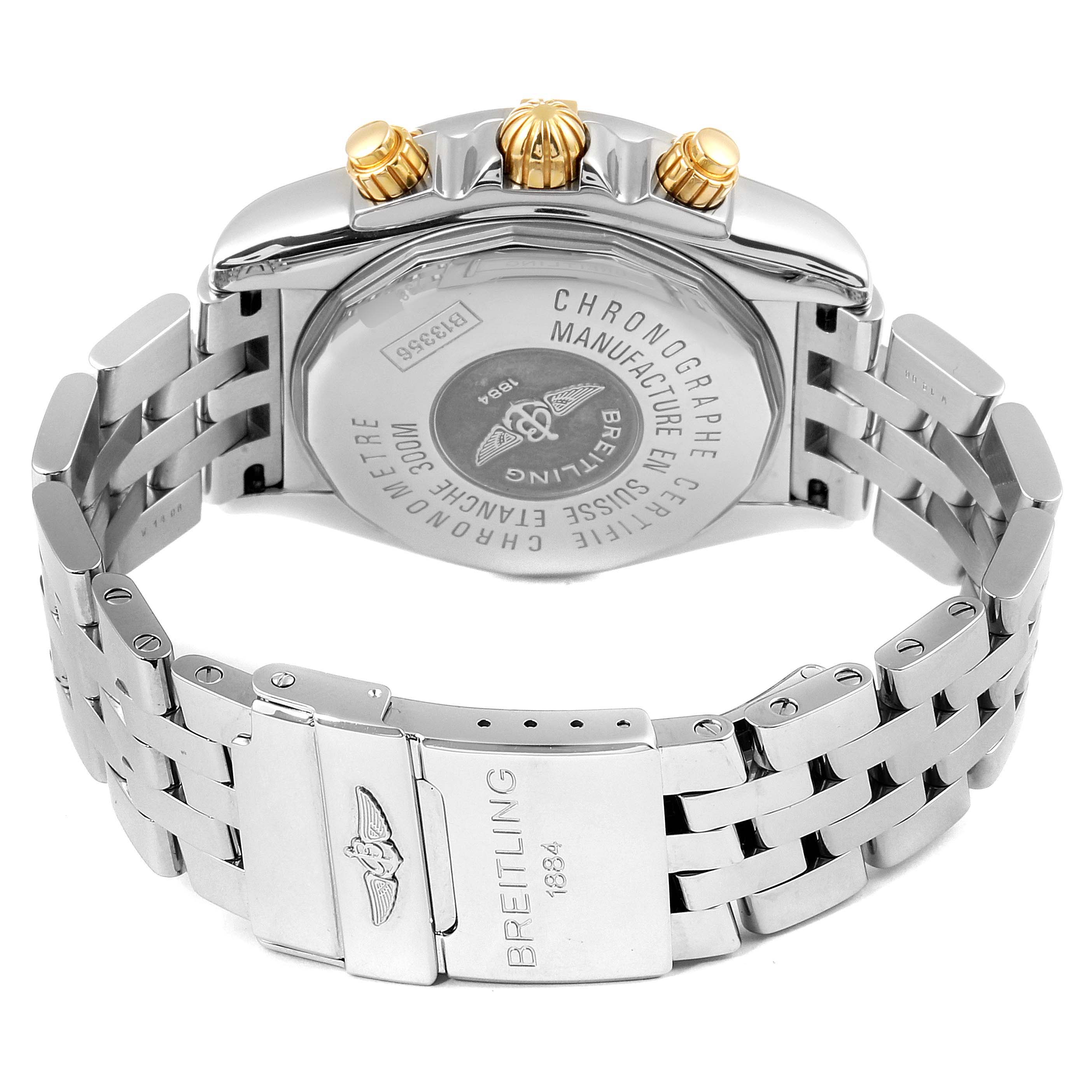 This image shows the backside and clasp of a Breitling Chronomat B13356 Men's Steel and Gold (two tone) Burgundy Dial B13356 Men's Steel and Gold (two tone) Burgundy Dial watch, highlighting the case back and stainless steel bracelet.