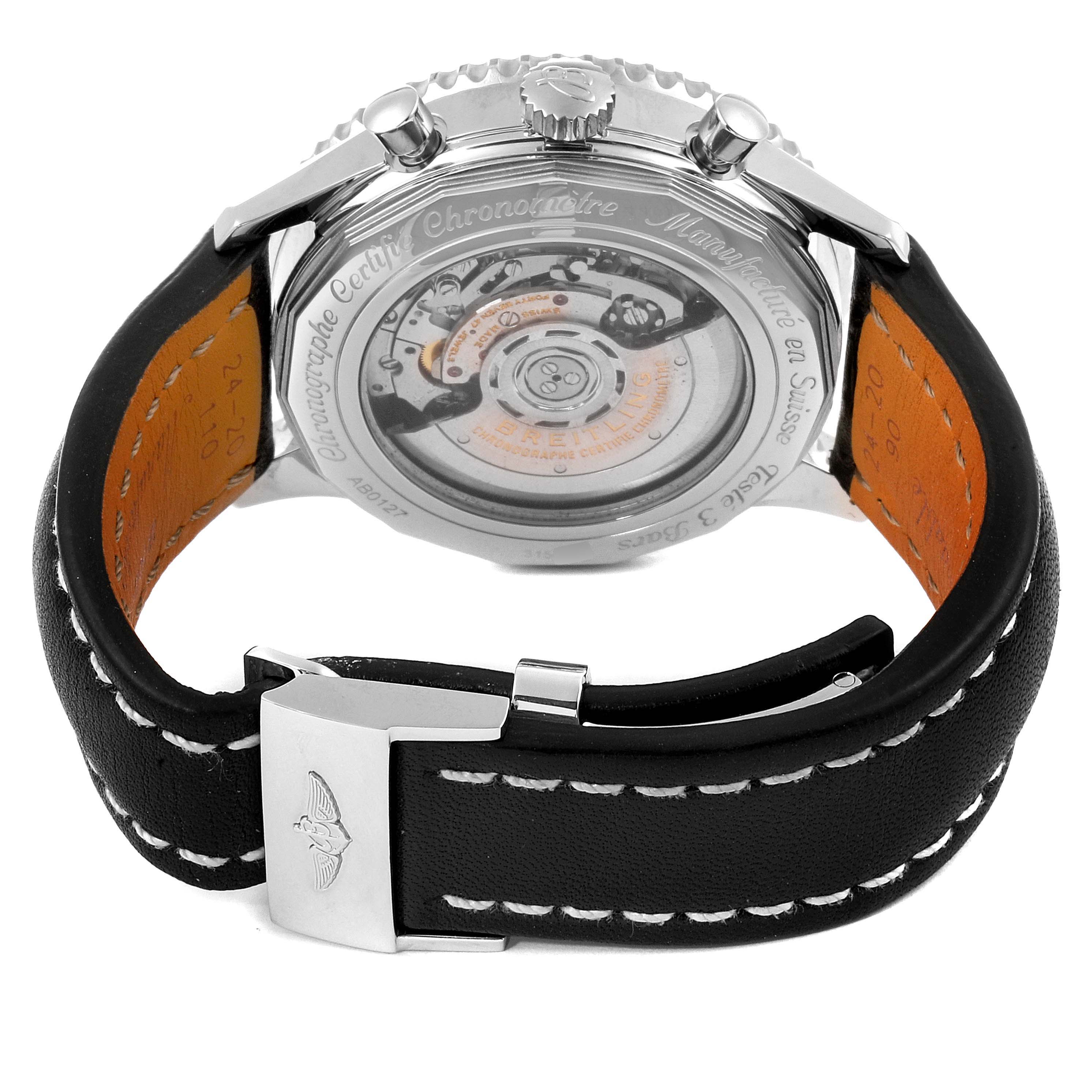 The image shows the reverse side of the Breitling Navitimer AB0127211C1A1 Men
s Stainless Steel Black Dial AB0127211C1A1 Men
s Stainless Steel Black Dial watch, including the movement through the transparent case back and the leather strap with a buckle.