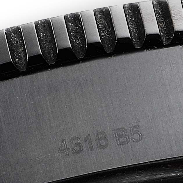 The image shows a close-up of the bezel and part of the casing of a Breitling Superocean M17393 Men
s Stainless Steel Black Dial M17393 Men
s Stainless Steel Black Dial watch.
