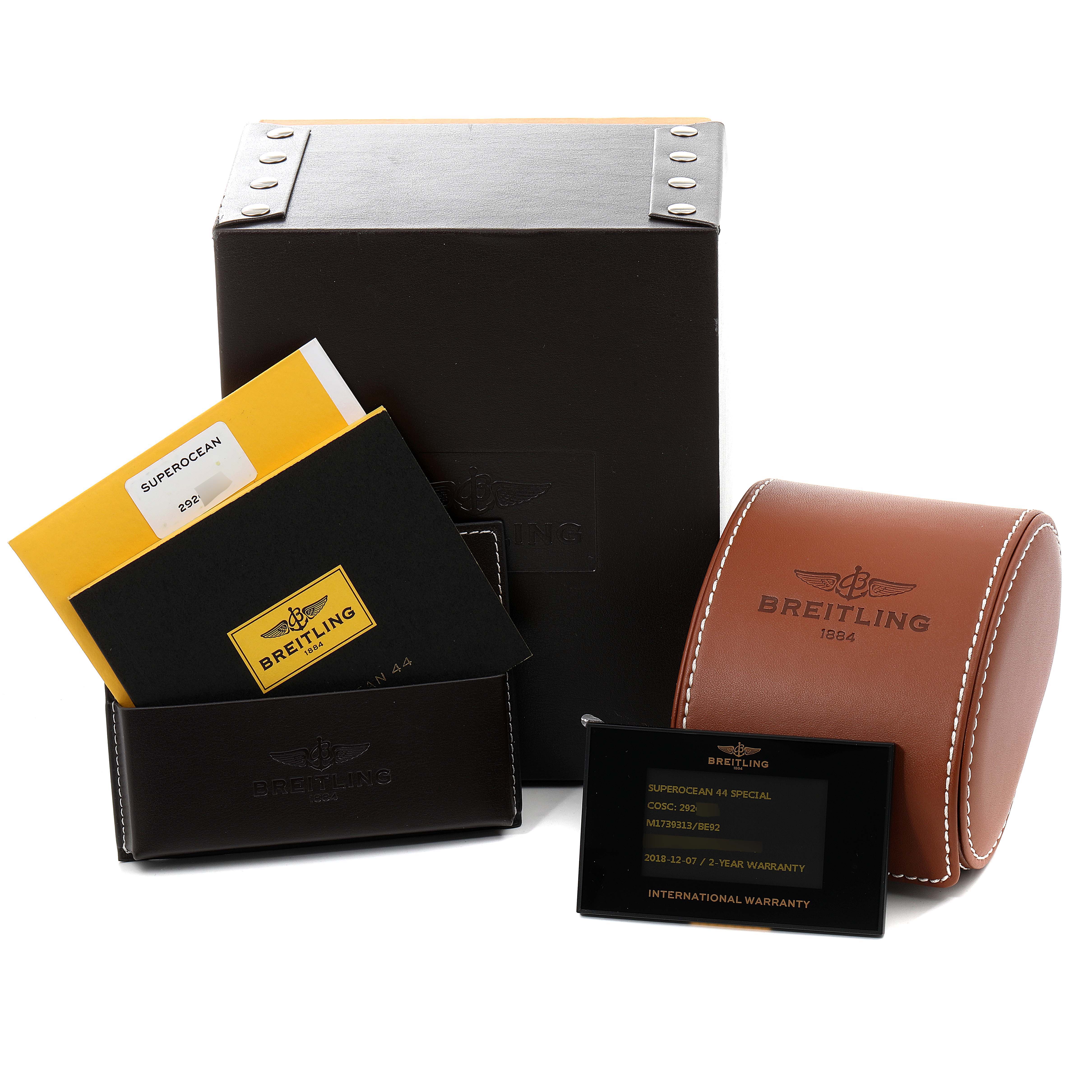 This image shows the Superocean model by Breitling, including its box, warranty card, and documentation.