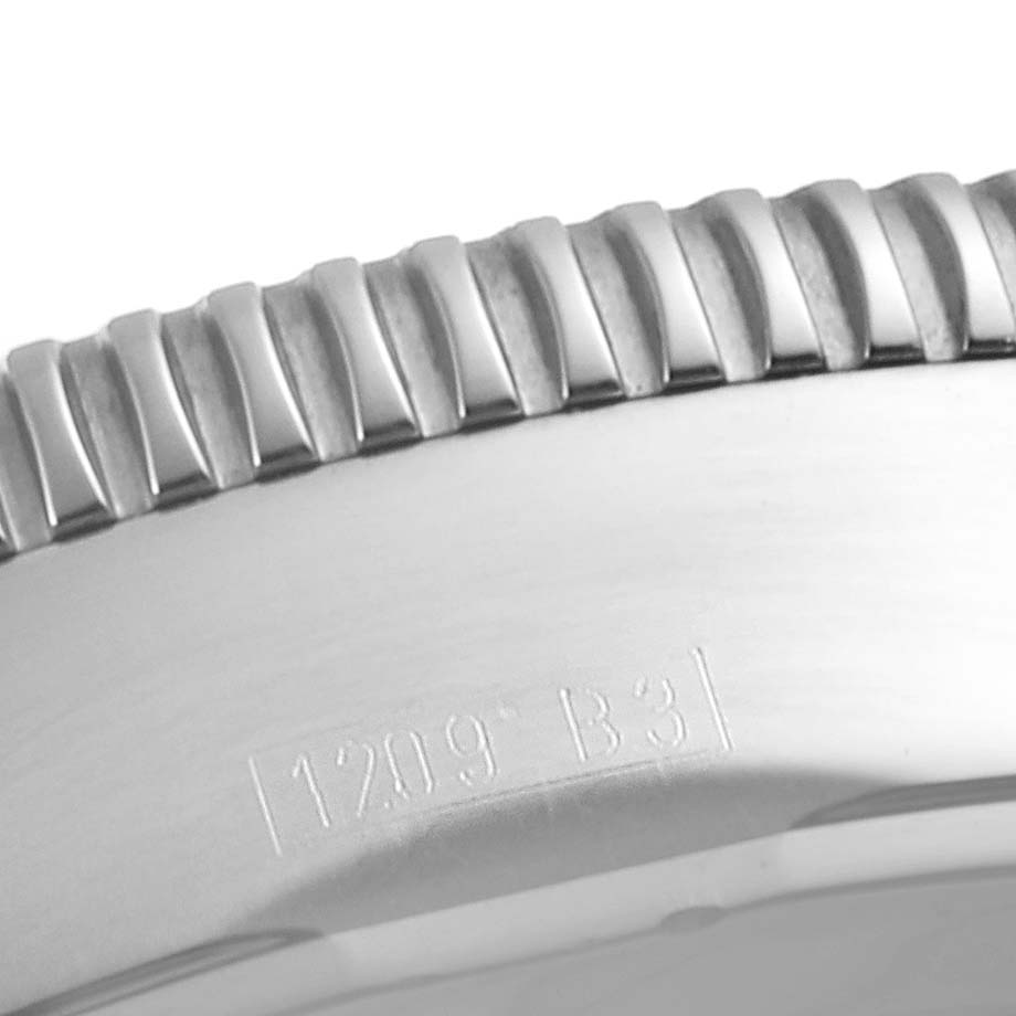 This close-up image shows the bezel and engraving on the case of a Breitling Superocean A13320 Men's Stainless Steel Silver Dial A13320 Men's Stainless Steel Silver Dial watch.