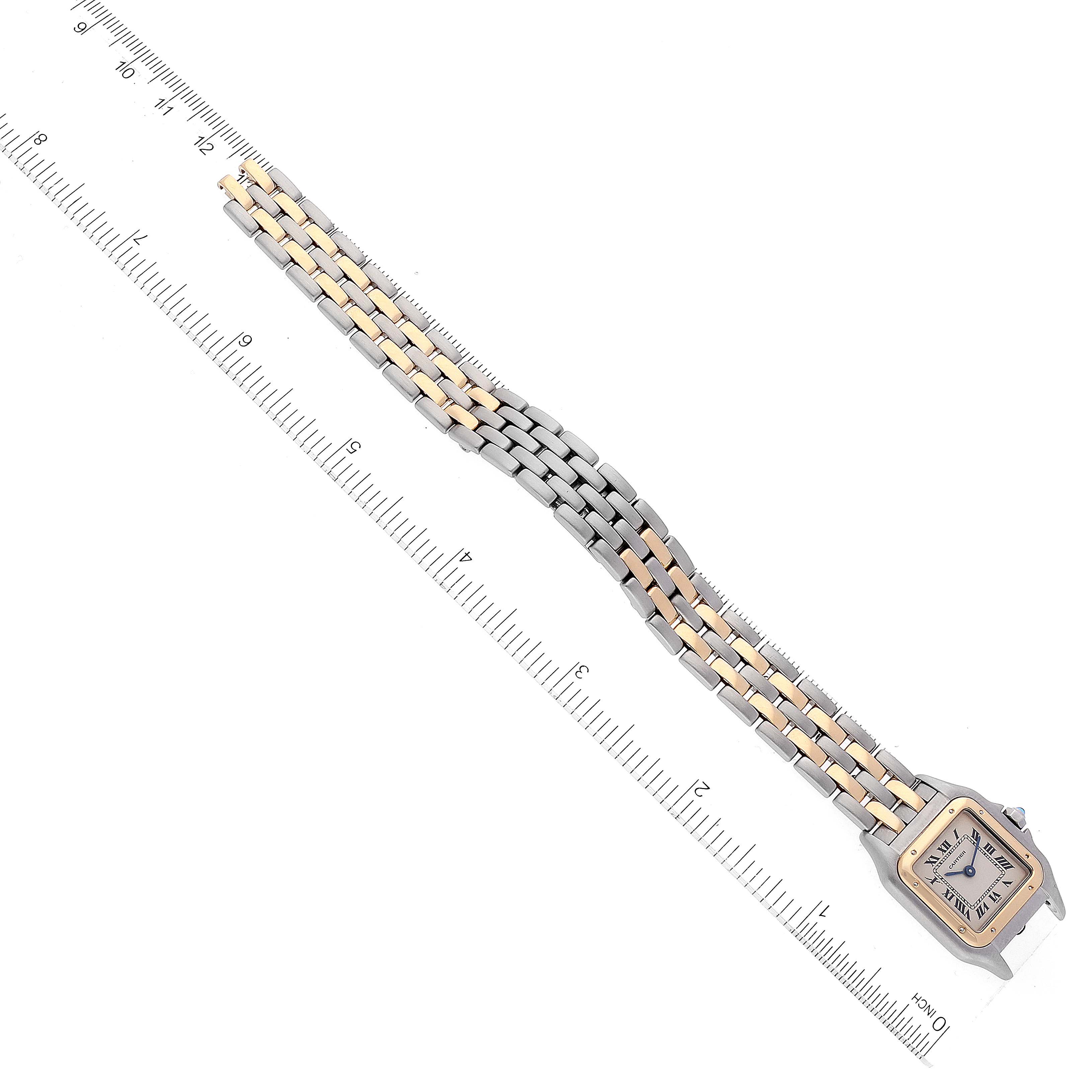 The image shows a top-down view of a Cartier Panthere W25029B6 Women's Steel and Gold (two tone) Silver Dial W25029B6 Women's Steel and Gold (two tone) Silver Dial watch with a ruler, highlighting the face and two-tone metal bracelet.