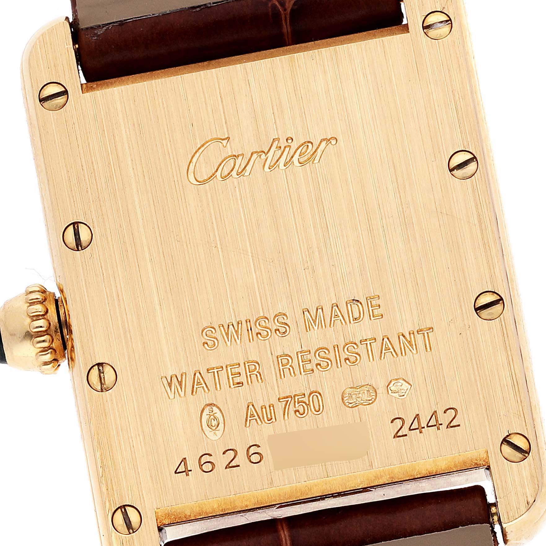 This image shows the back of a Cartier Tank Louis W1529856 Women
s Yellow Gold Silver Dial W1529856 Women
s Yellow Gold Silver Dial watch, displaying inscriptions, screws, and part of the leather strap.