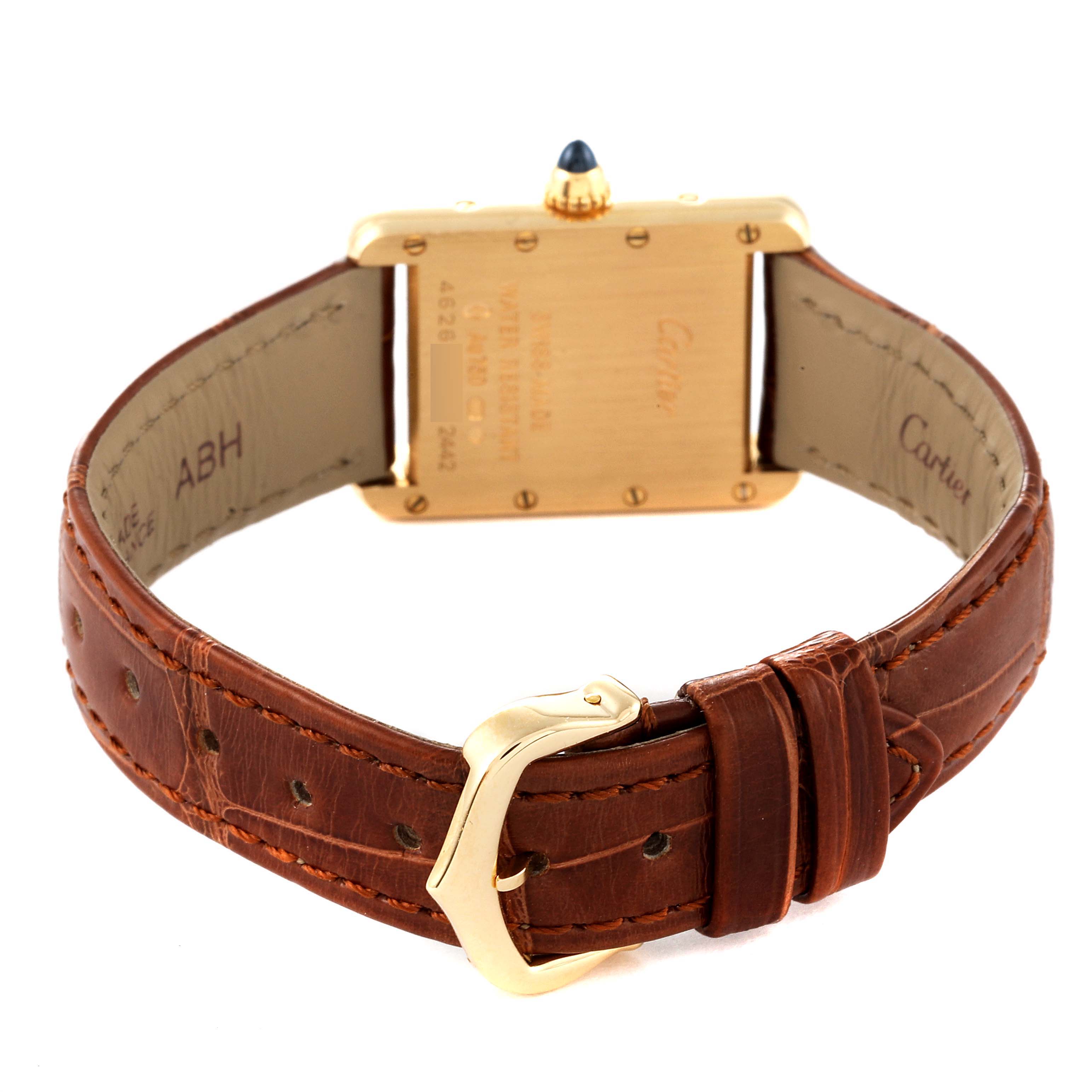 The image shows the back view of a Cartier Tank Louis W1529856 Women
s Yellow Gold Silver Dial W1529856 Women
s Yellow Gold Silver Dial model watch, highlighting the buckle and leather strap.