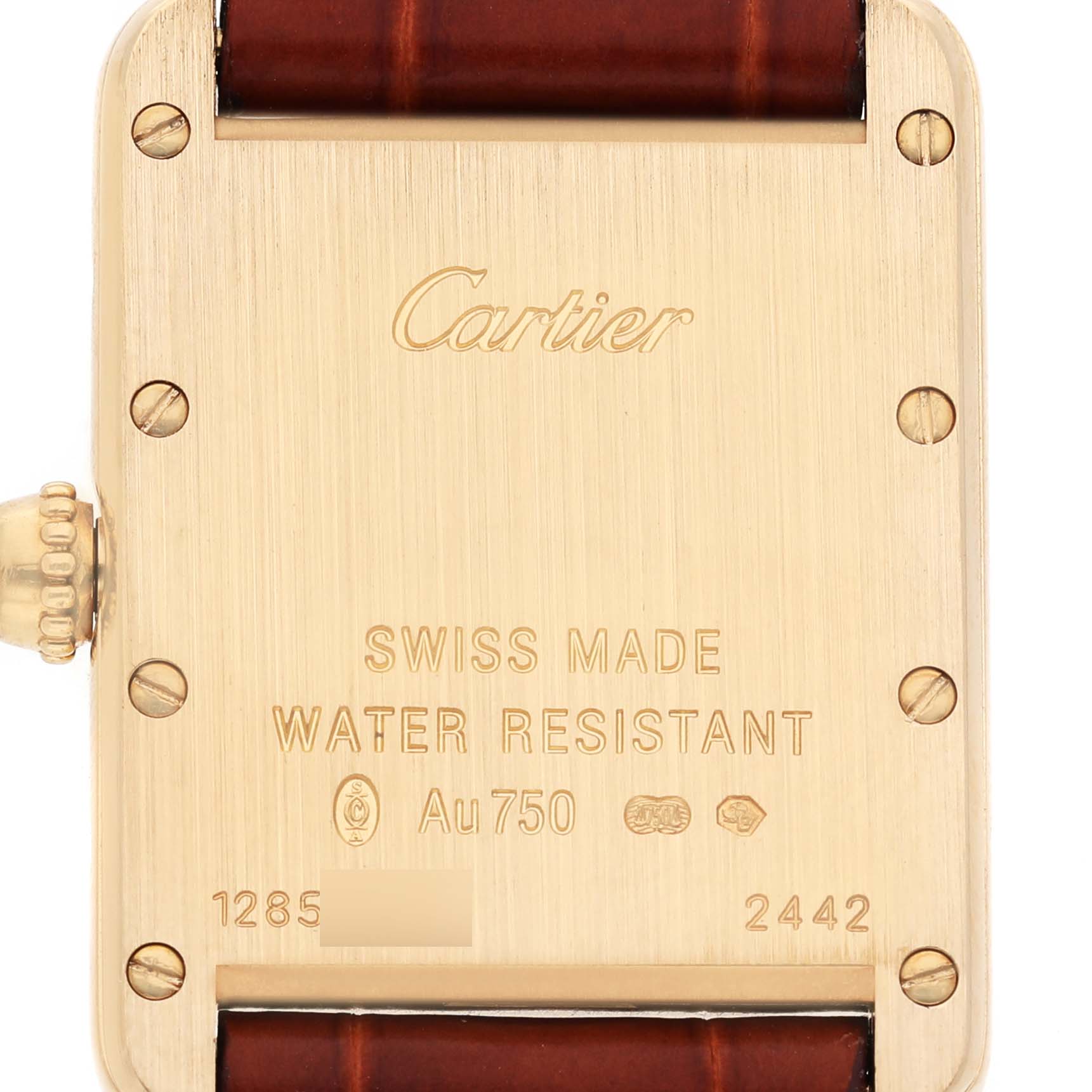 The image shows the back of a Cartier Tank Louis W1529856 Women's Yellow Gold Silver Dial watch, highlighting its Swiss Made marking and water resistance details.