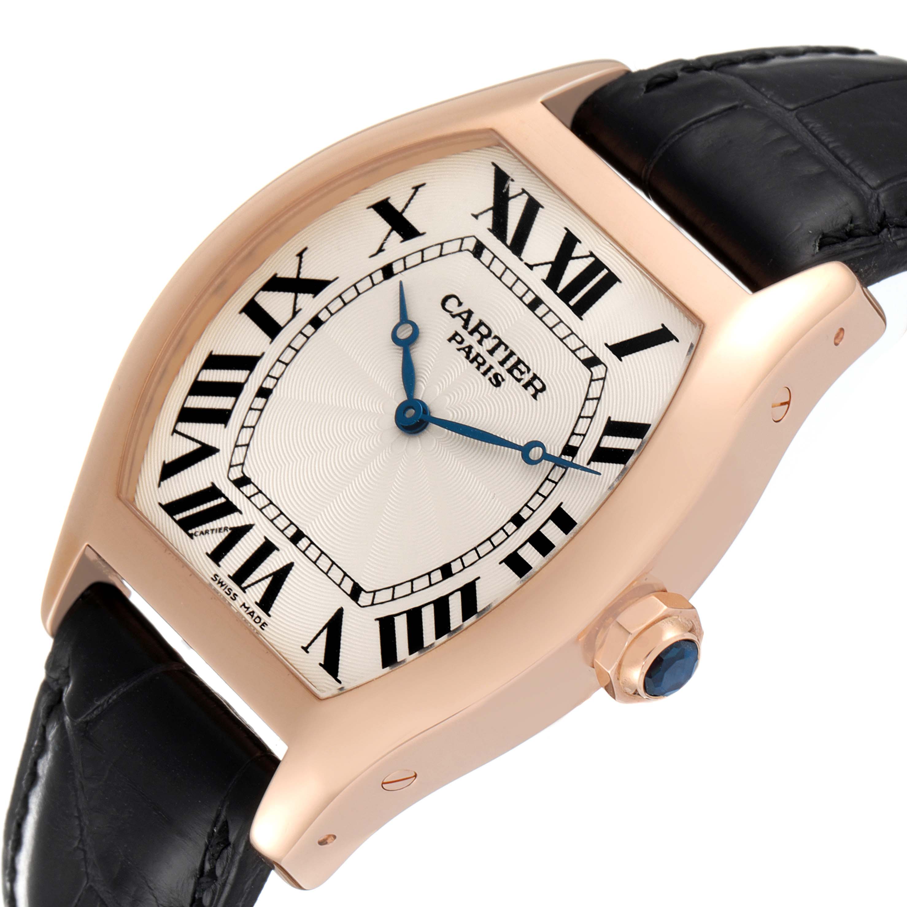 The image shows a close-up view of a Cartier Tortue W1546051 Men's Rose Gold Silver Dial W1546051 Men's Rose Gold Silver Dial watch displaying the dial, crown, and part of the black strap.