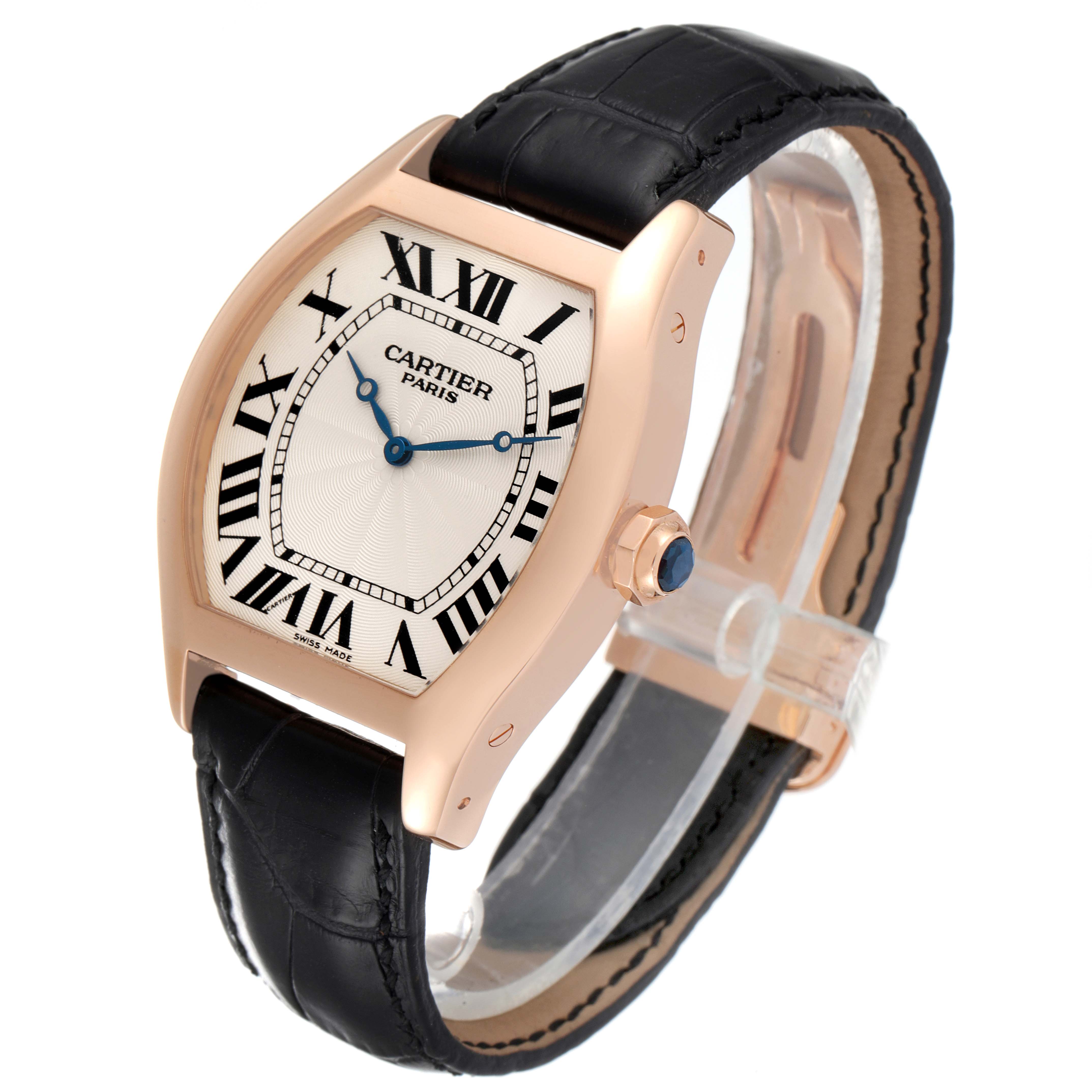 The Cartier Tortue W1546051 Men's Rose Gold Silver Dial W1546051 Men's Rose Gold Silver Dial watch is shown at a slight side angle, displaying the face, Roman numerals, crown, and black leather strap.