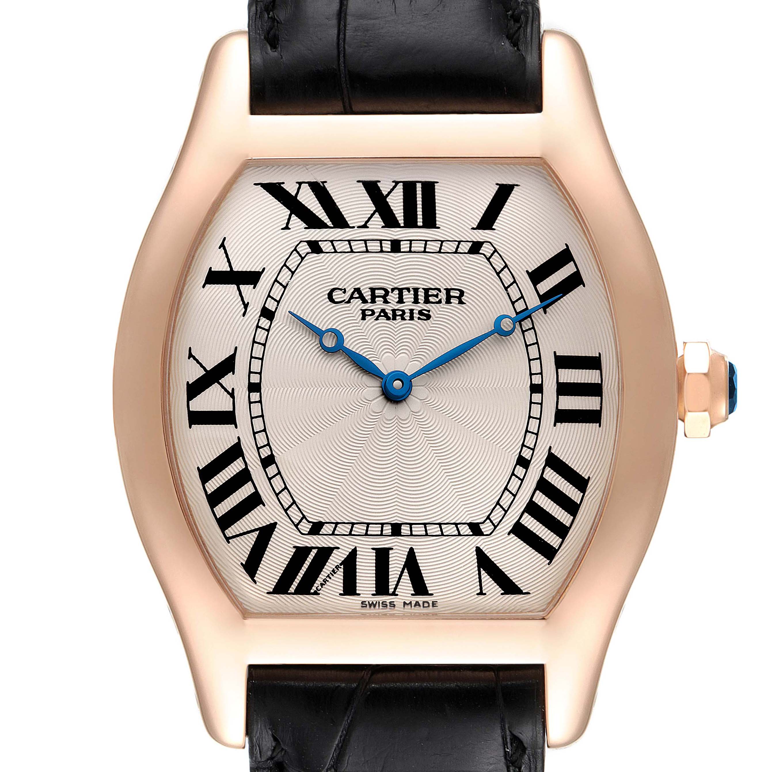 The image shows the face of the Tortue model by Cartier, highlighting the dial, Roman numerals, blue hands, and part of the band.