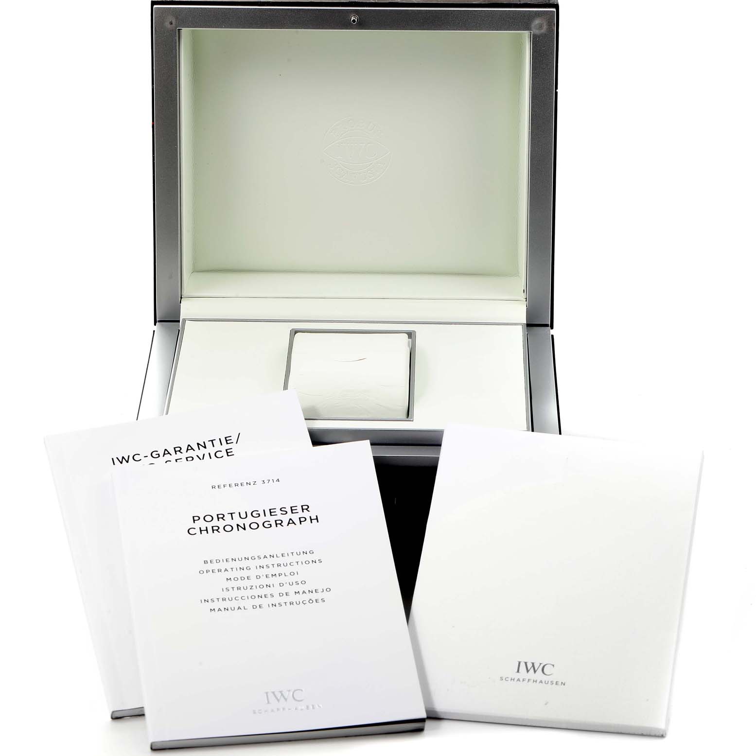 The image shows an open box for the IWC Pilot IW327006 Men's Titanium Black Dial IW327006 Men's Titanium Black Dial watch and three booklets.