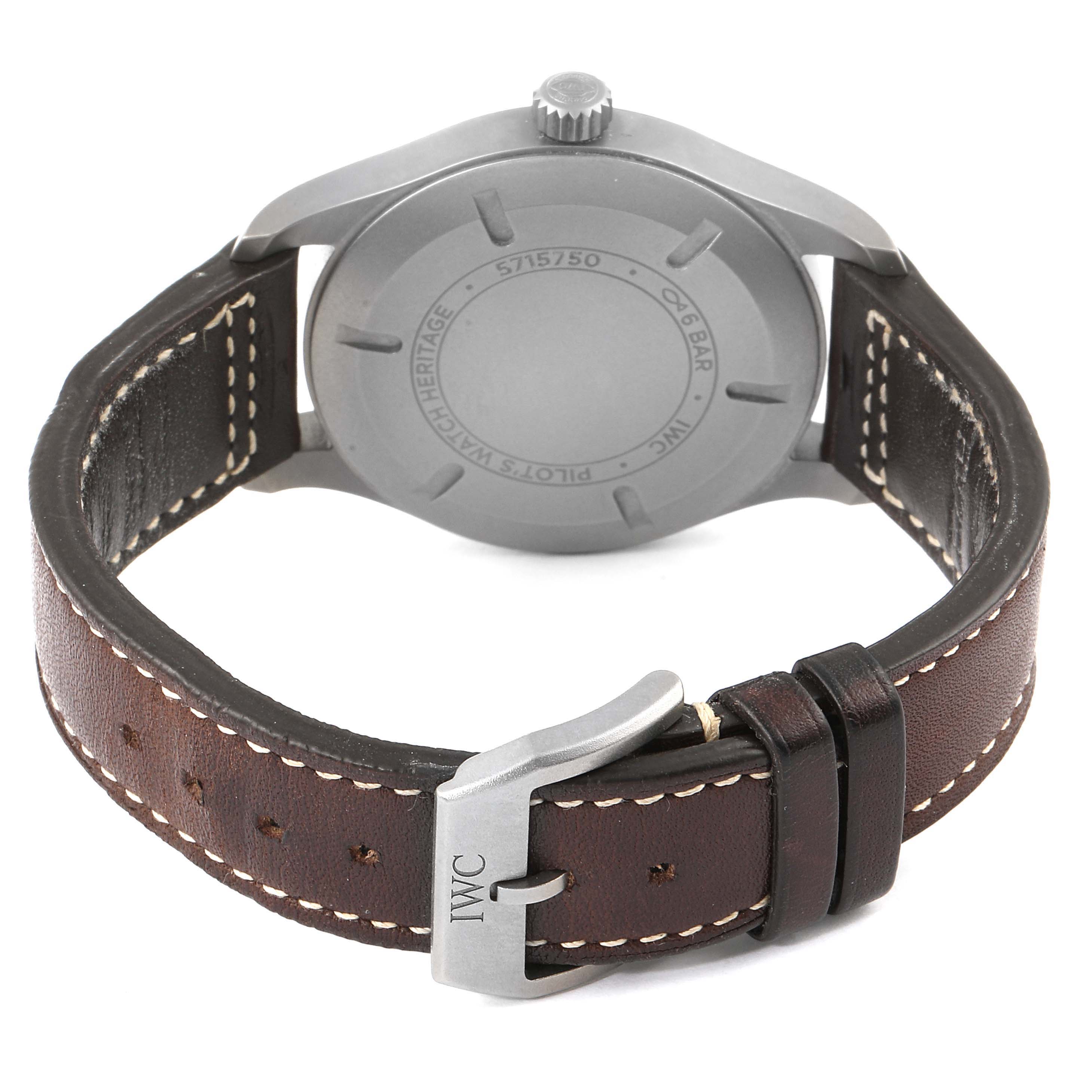 The image shows the back side of an IWC Pilot IW327006 Men's Titanium Black Dial IW327006 Men's Titanium Black Dial model watch, highlighting the case back and leather strap with buckle.