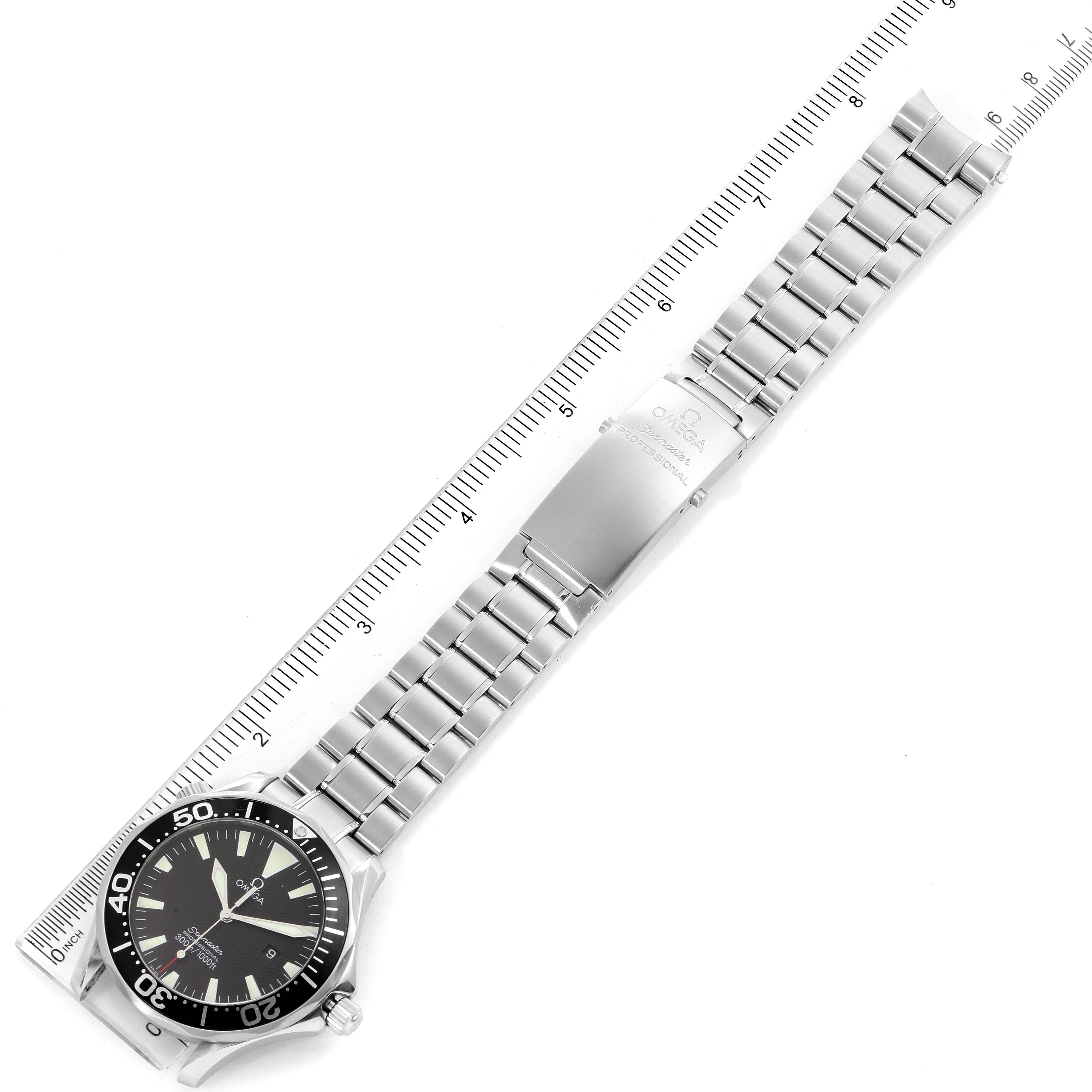 The image shows an Omega Seamaster 2264.50.00 Men's Stainless Steel Black Dial 2264.50.00 Men's Stainless Steel Black Dial watch laid flat with a metal bracelet and clasp, aligned next to a ruler for measurement.