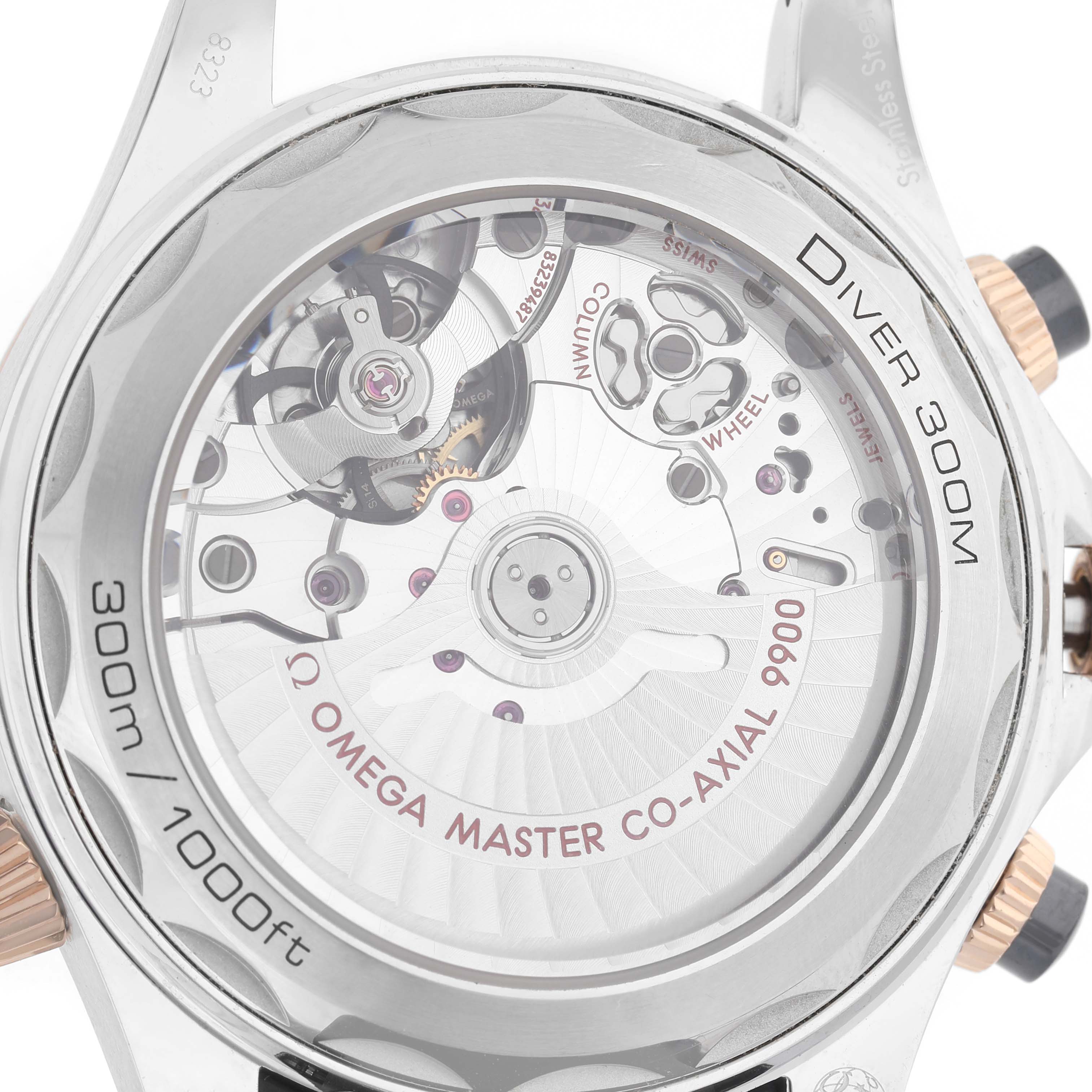 The image shows the transparent case back of an Omega Seamaster 210.22.44.51.01.001 Men's Steel and Gold (two tone) Black Dial, revealing the movement and mechanical parts.