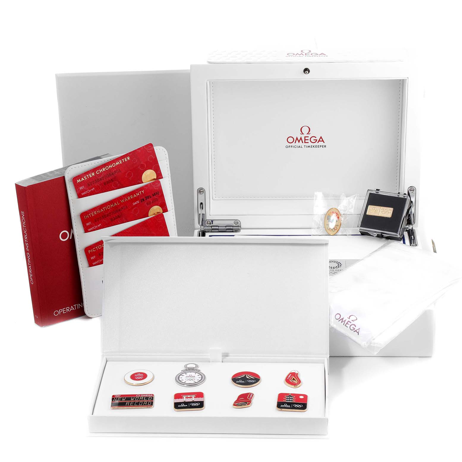 The image shows the accessories and packaging of an Omega Seamaster 522.30.42.20.04.001 Men's Stainless Steel White Dial 522.30.42.20.04.001 Men's Stainless Steel White Dial, including the box, warranty cards, and additional items.