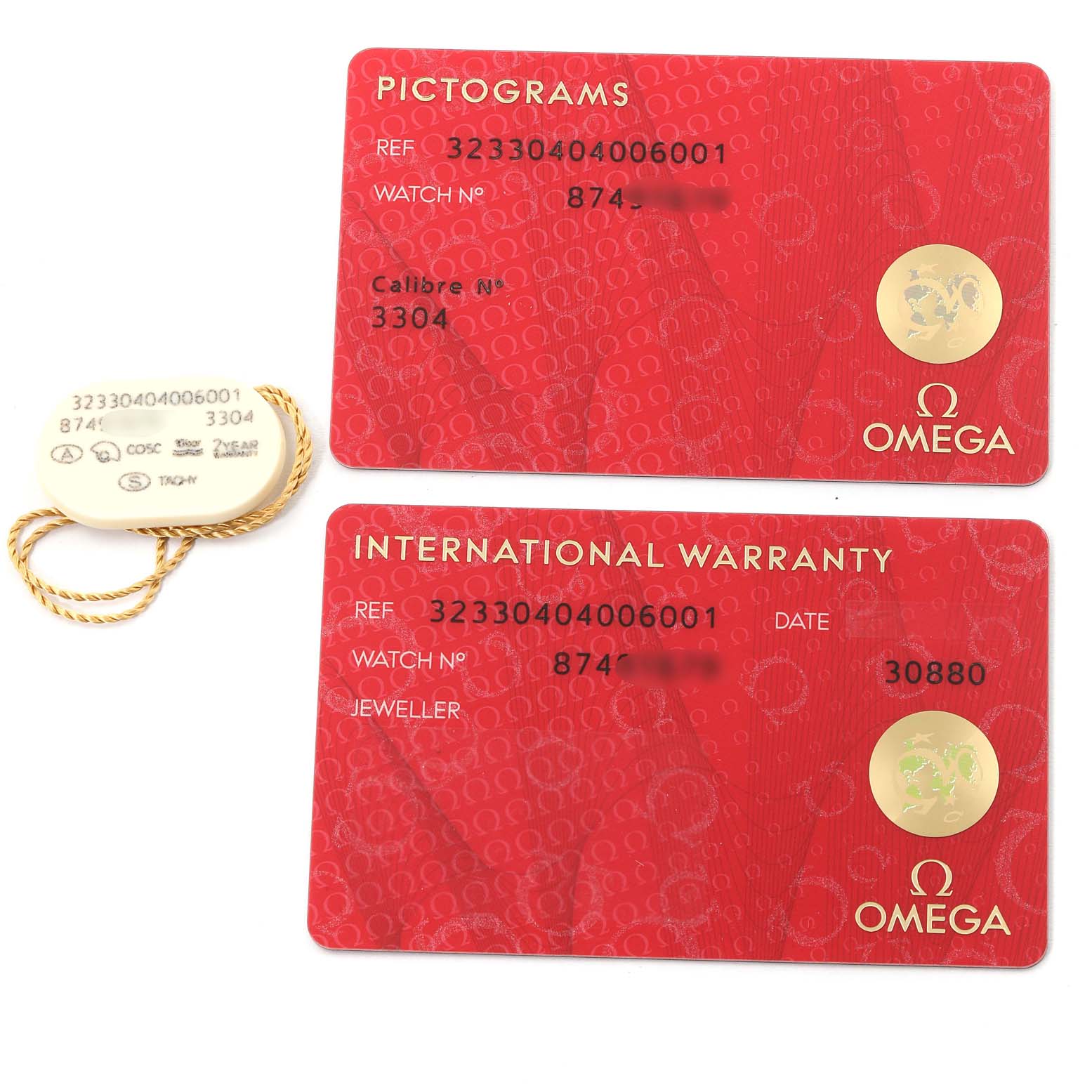 The image shows the pictograms card, international warranty card, and a hang tag for the Omega Speedmaster 323.30.40.40.06.001 Men's Stainless Steel Grey Dial 323.30.40.40.06.001 Men's Stainless Steel Grey Dial model.