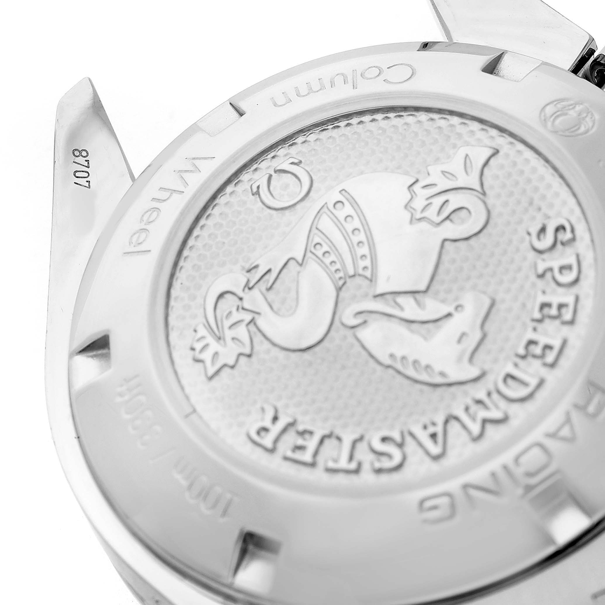 The image shows the case back of an Omega Speedmaster 326.30.40.50.02.001 Men's Stainless Steel Silver Dial, highlighting the engraved logo and text.