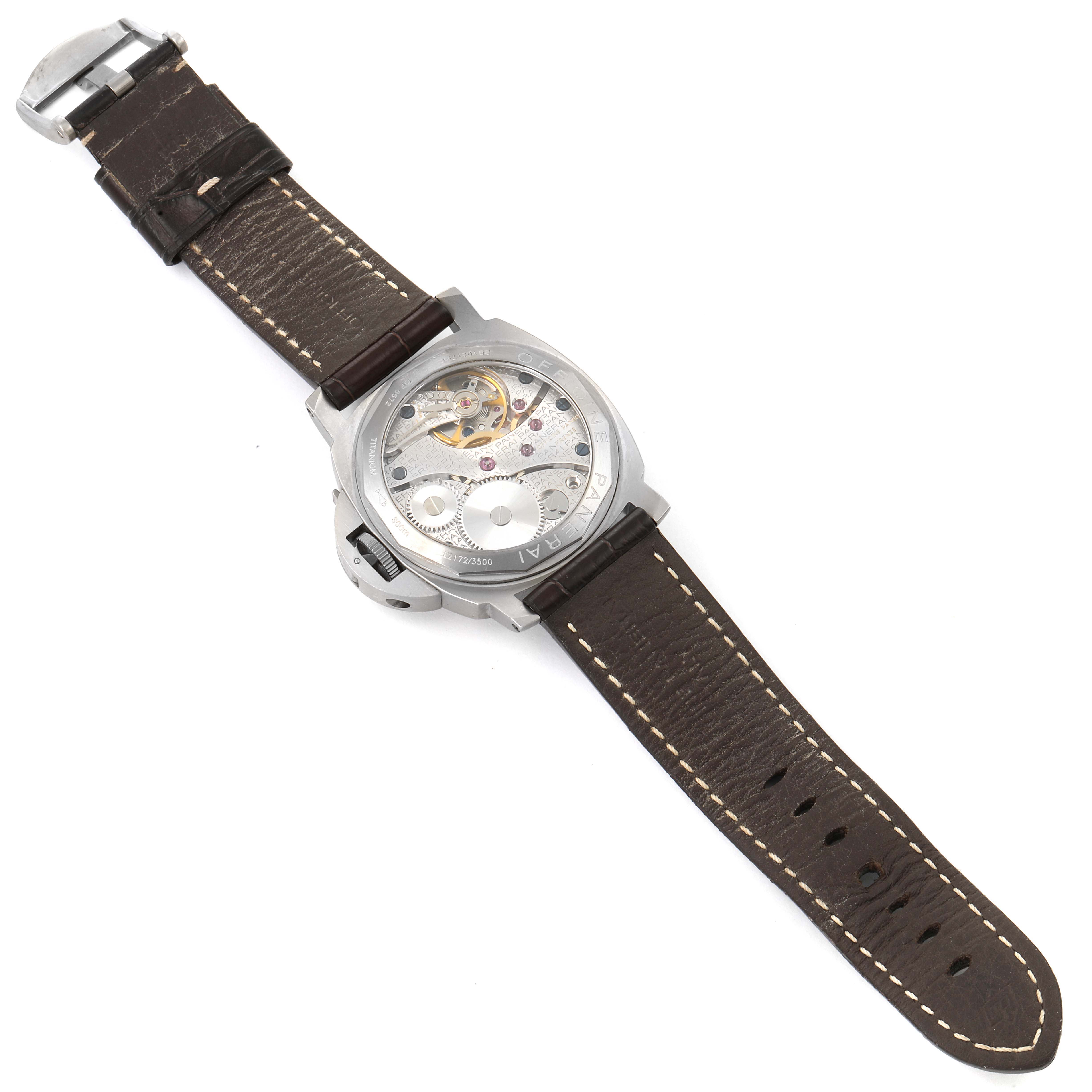 The image shows the back view of the Panerai Luminor PAM00118 Men's Titanium Brown Dial PAM00118 Men's Titanium Brown Dial watch, highlighting the movement and leather strap. 
